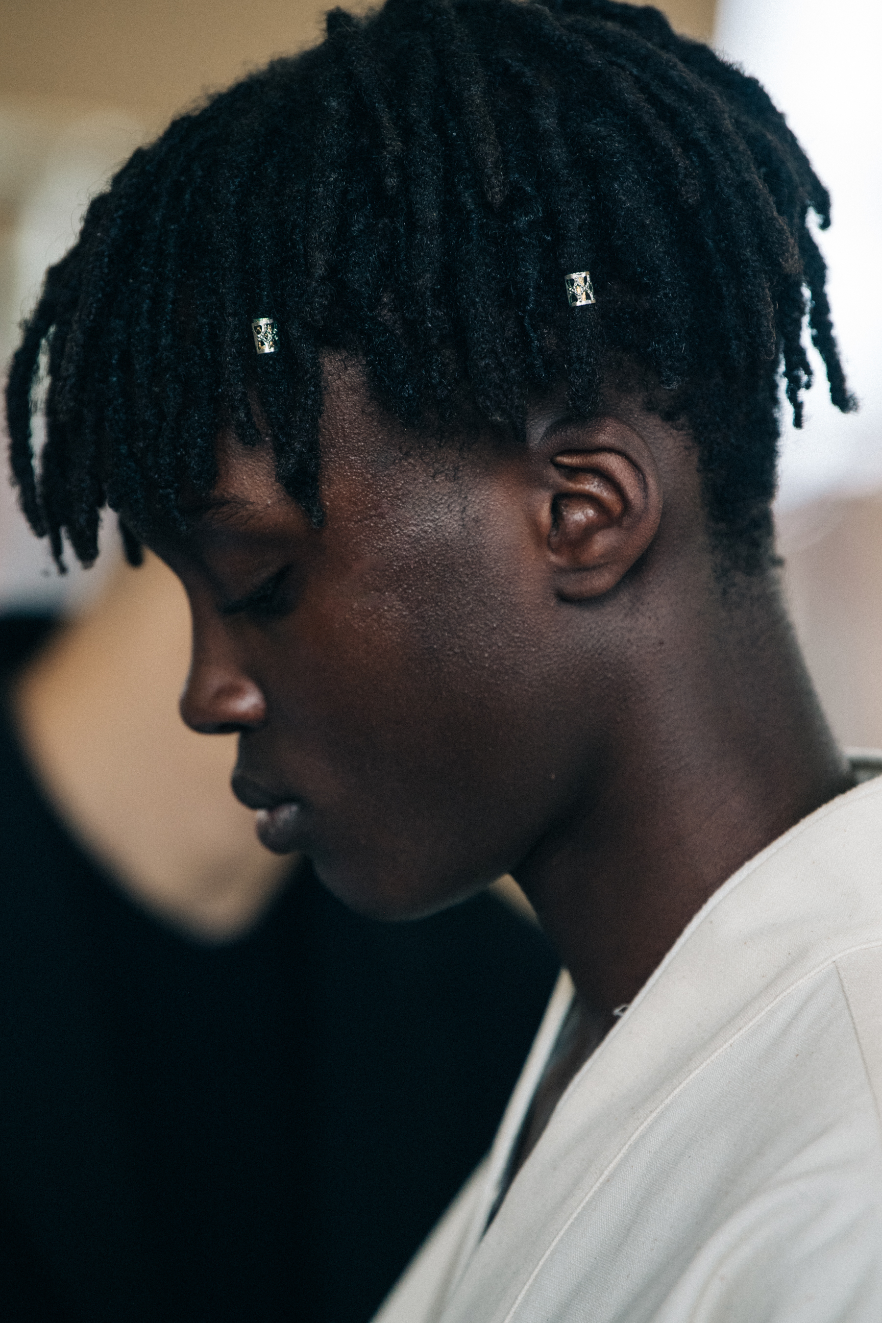 Mo M'bengue backstage at Jil Sander