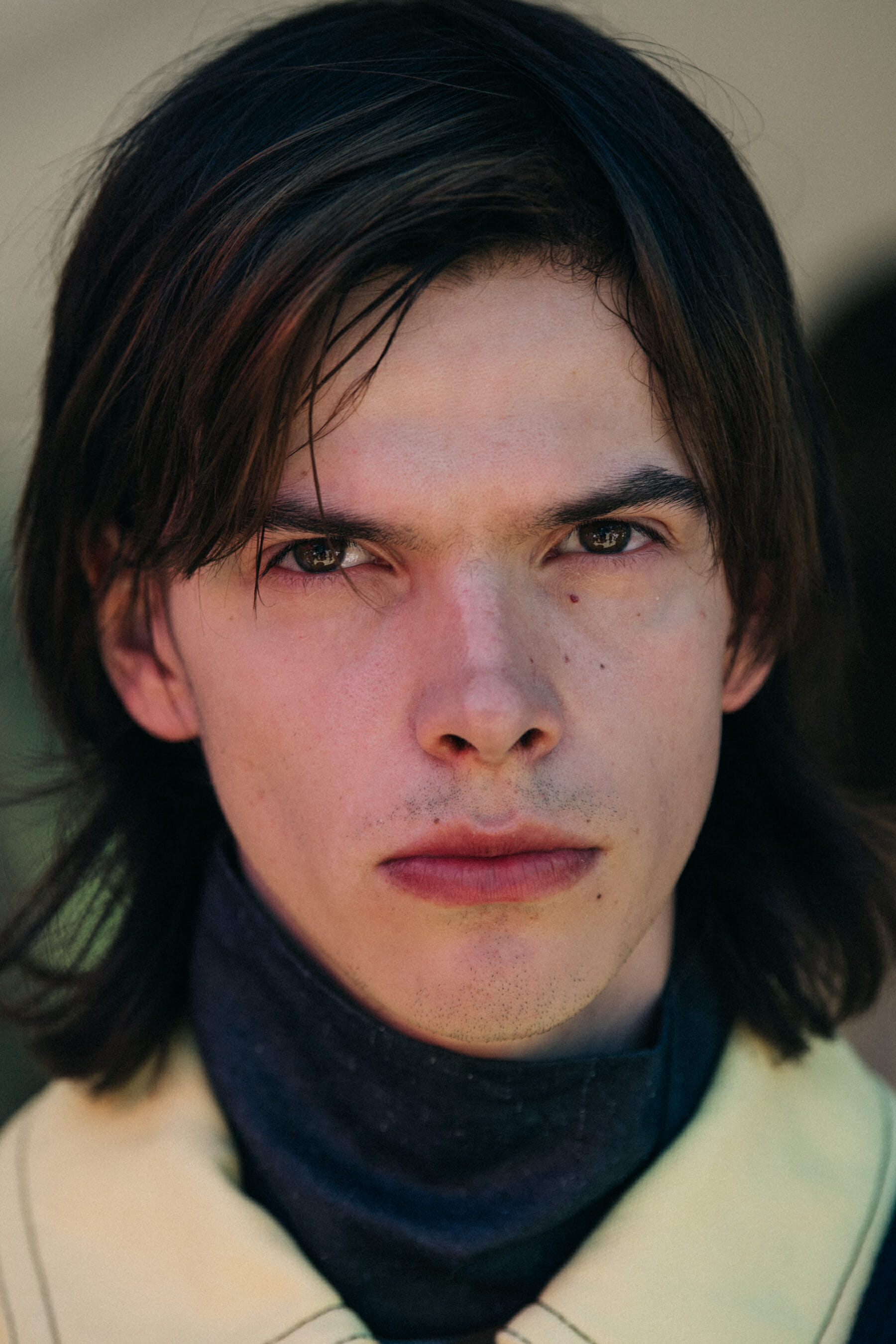 Portrait of model with thick dark hair