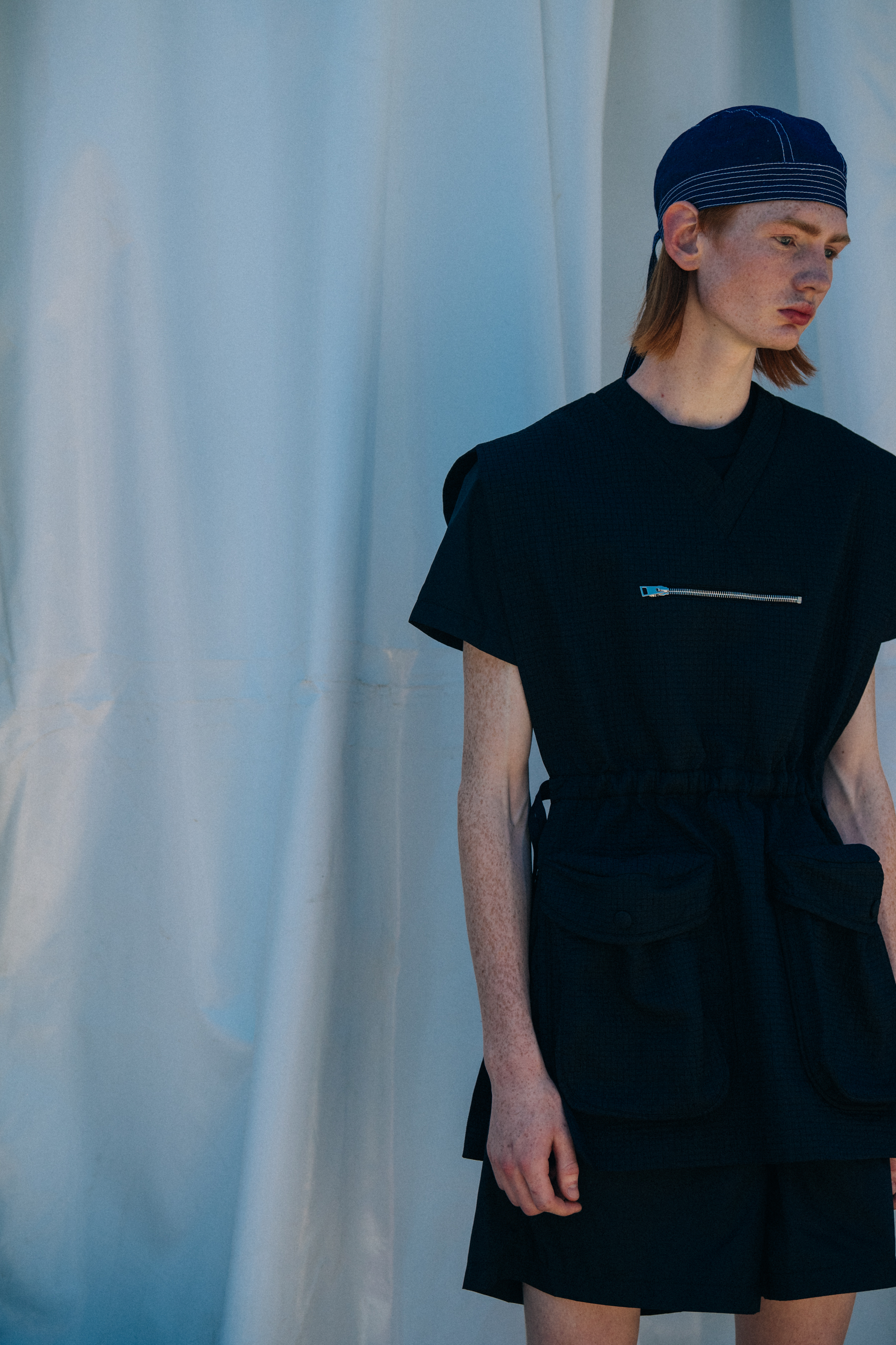 Model wearing dark Sunnei outfit