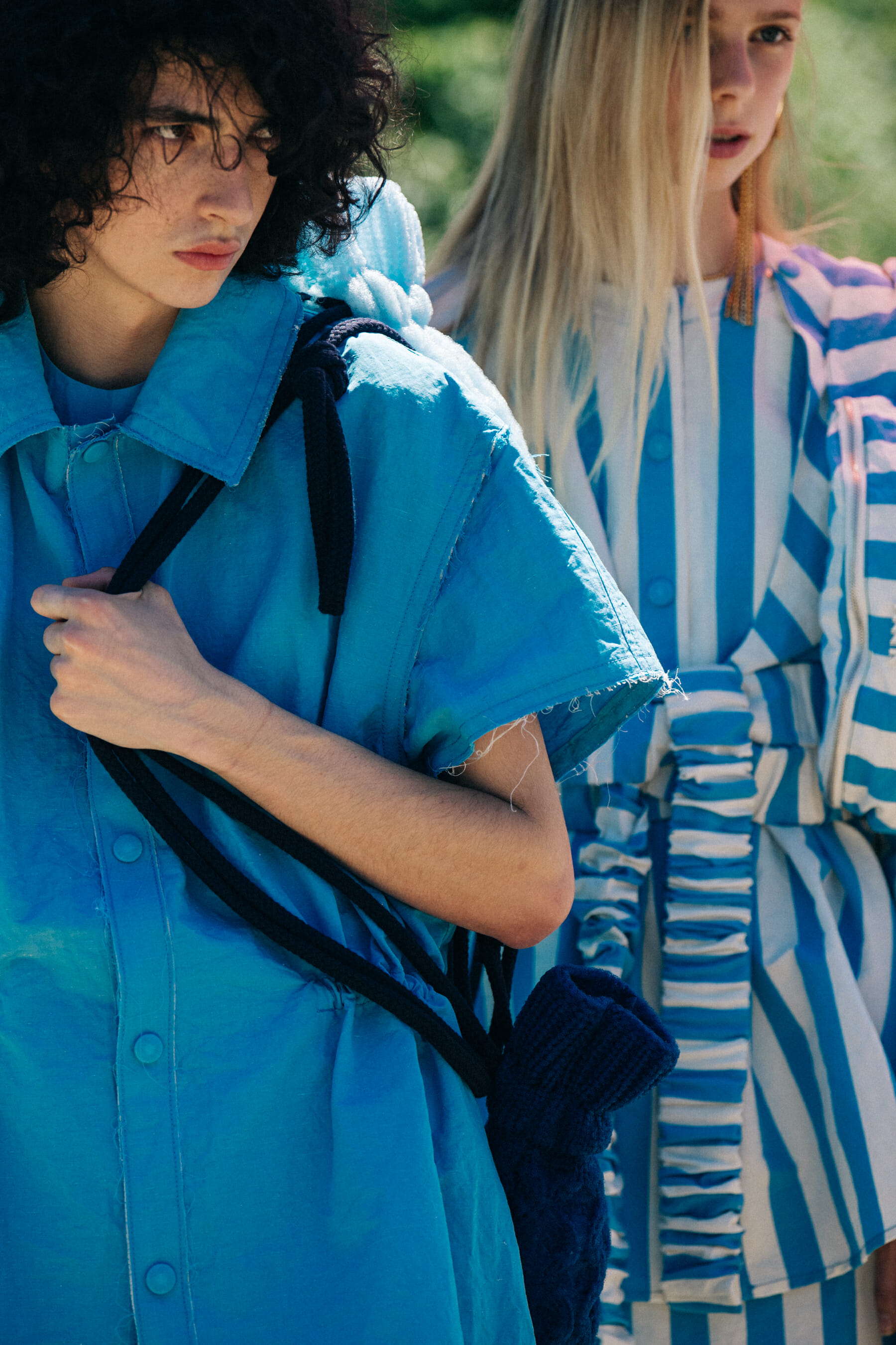 Model wearing striped Sunnei outfit