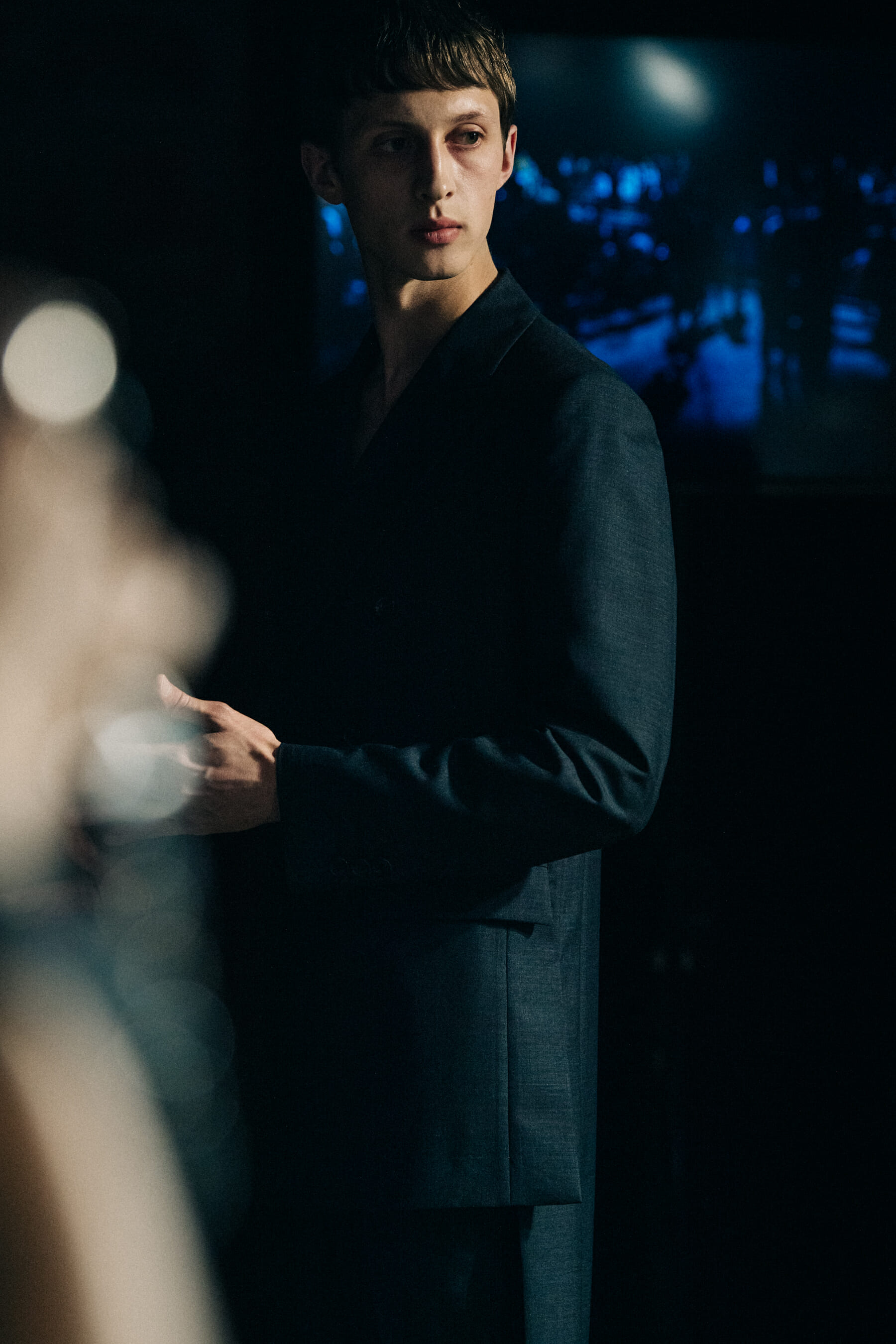 Model wearing black Undercover suit