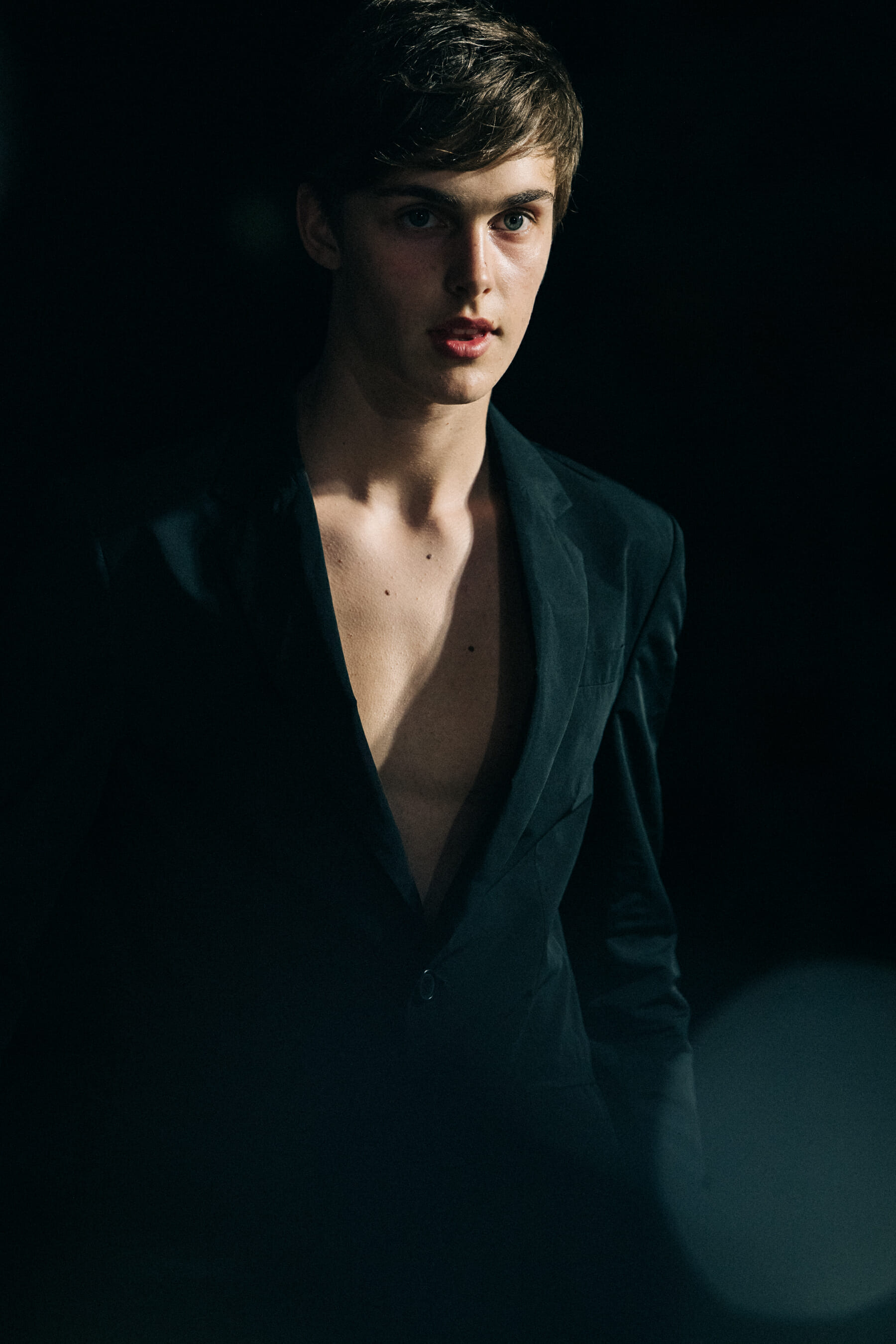 Model wearing black Undercover suit