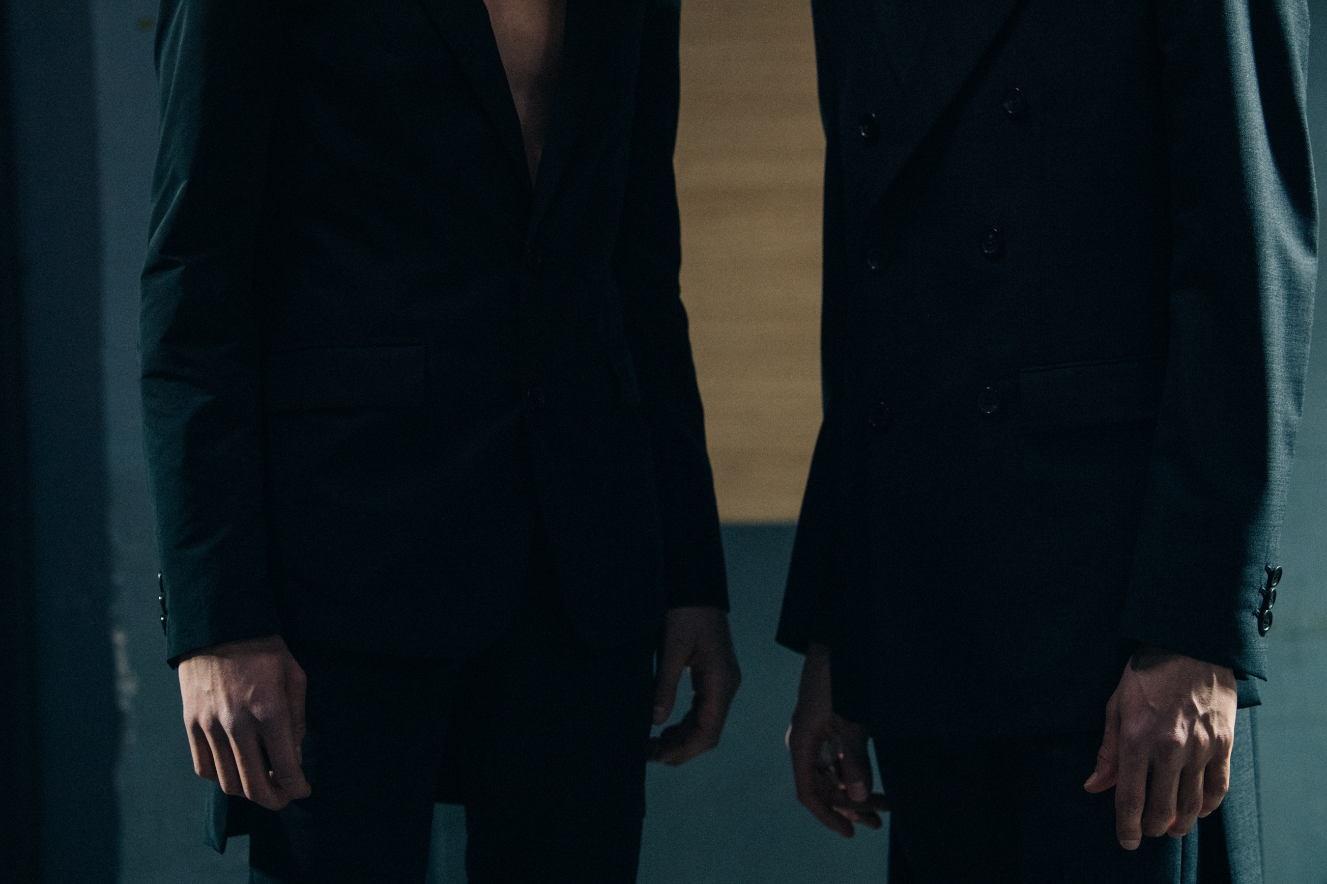 Model wearing black Undercover suit
