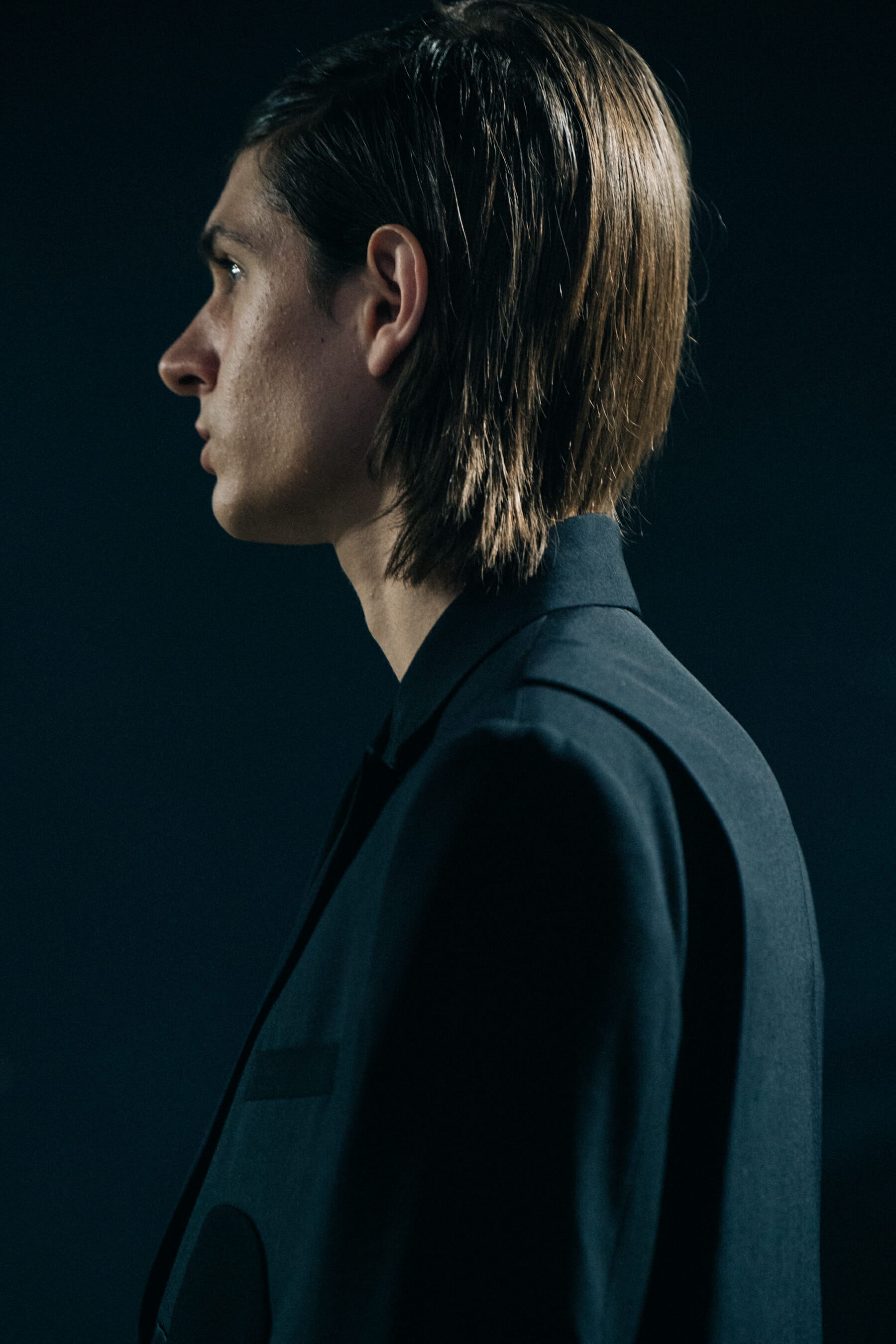 Model wearing black Undercover suit