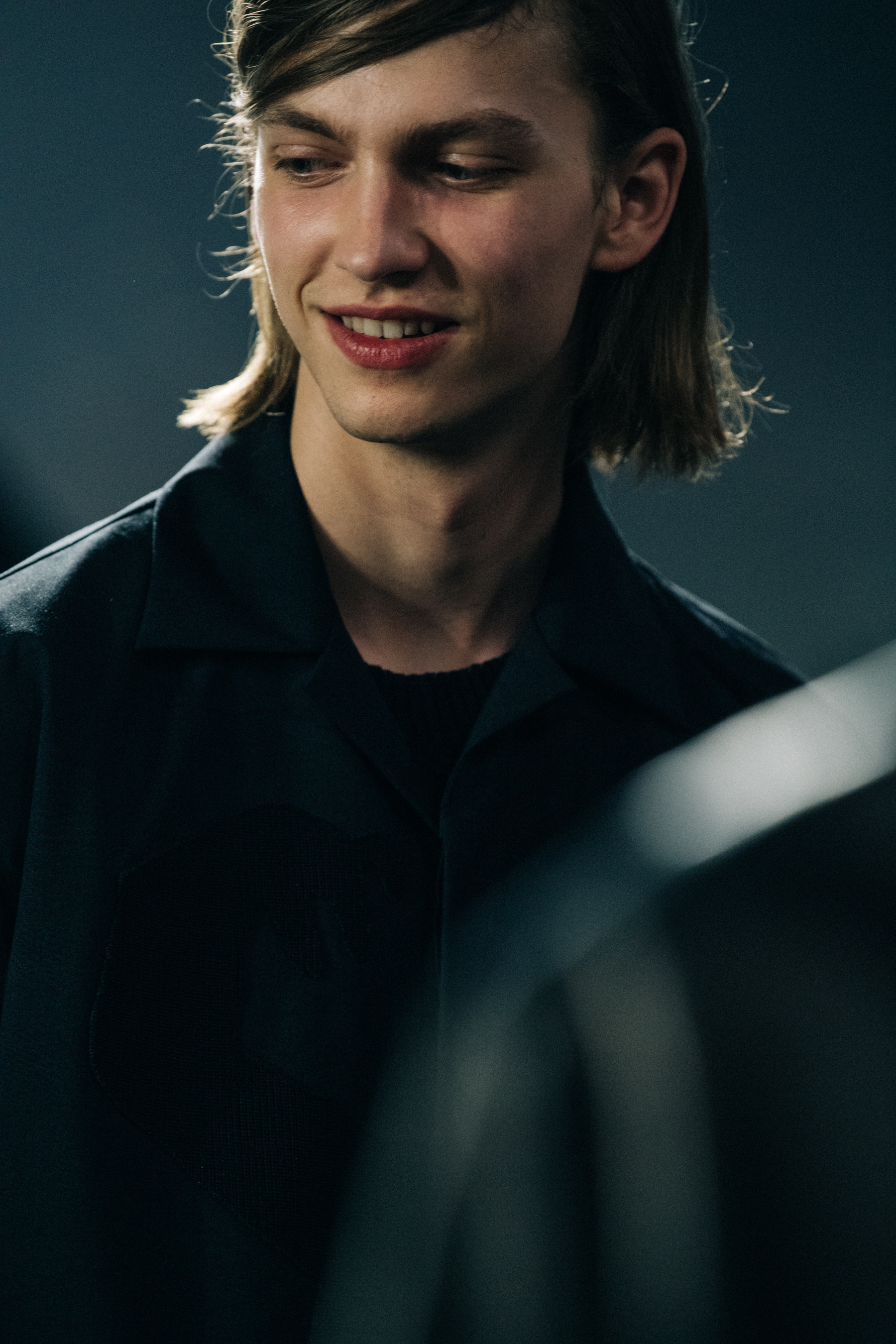 Model wearing black Undercover suit