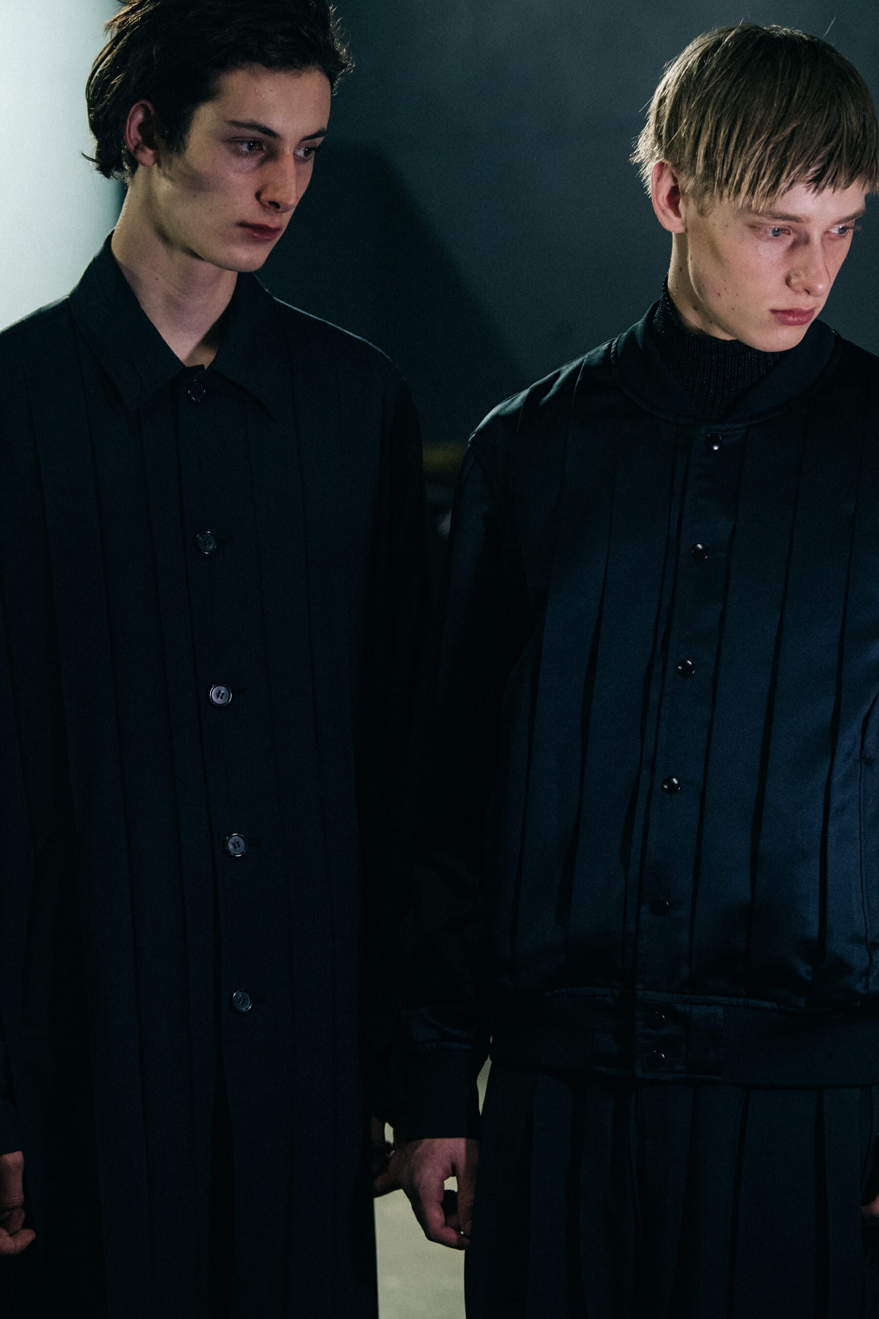 Model wearing black Undercover suit