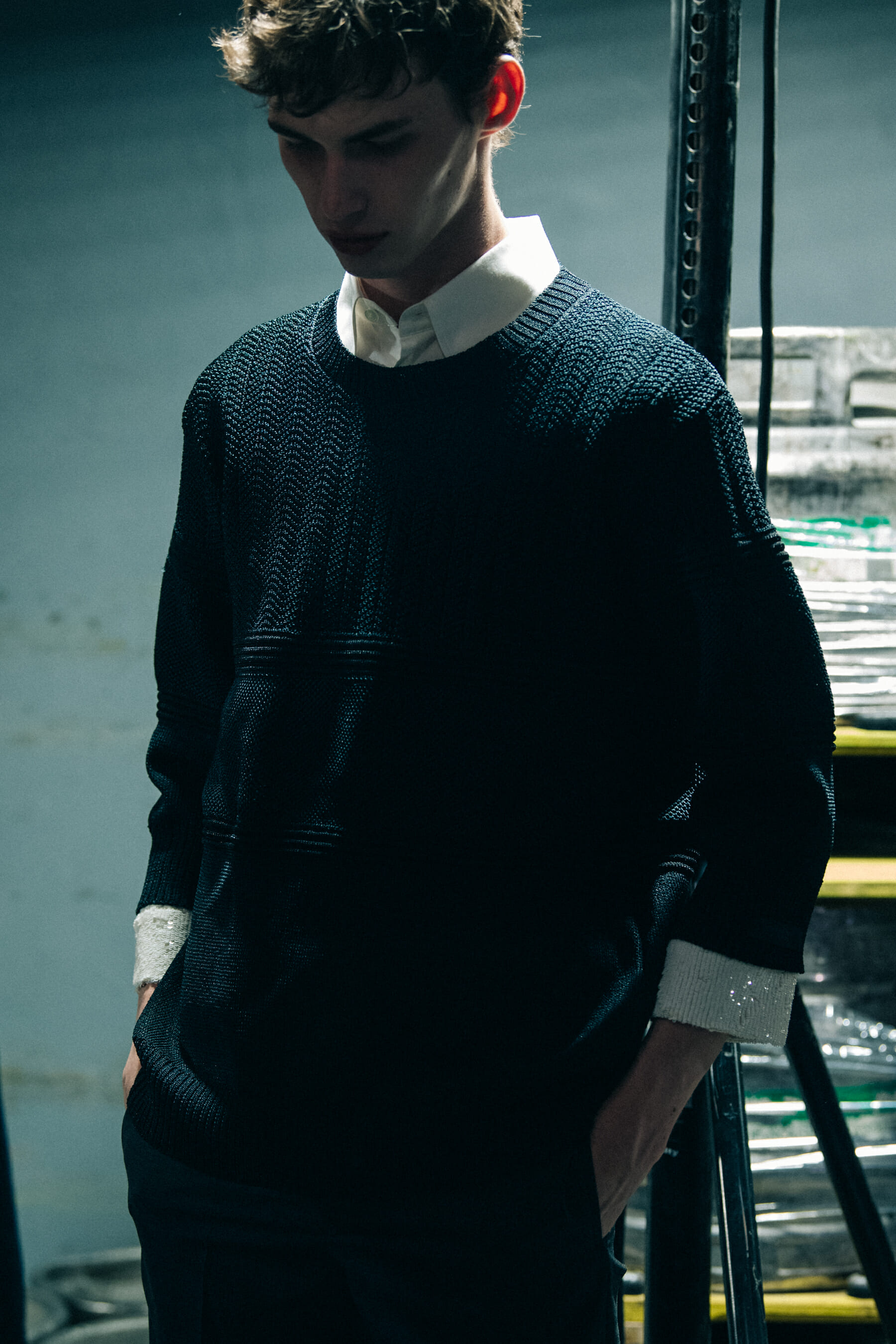 Model wearing black Undercover suit