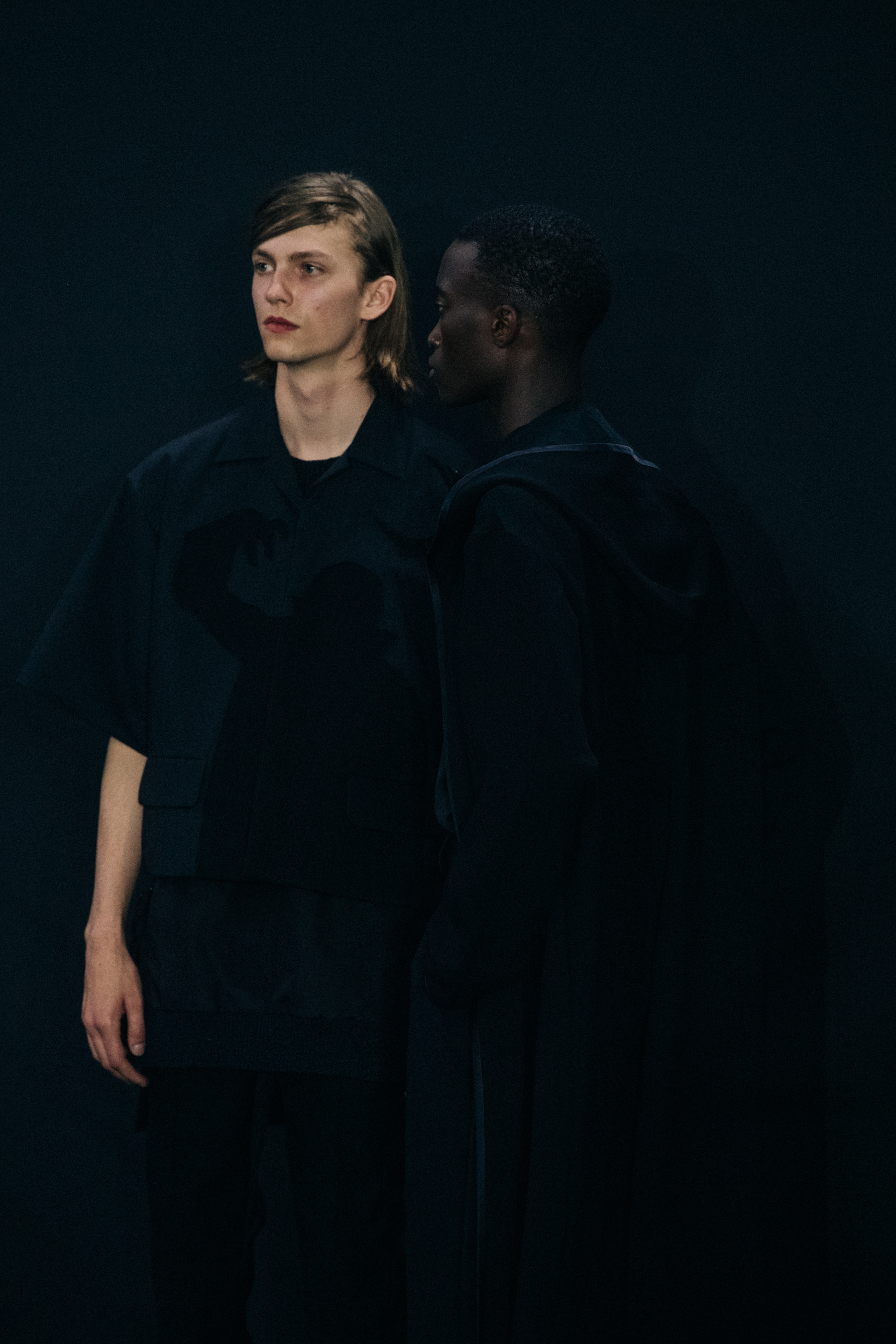 Model wearing black Undercover suit