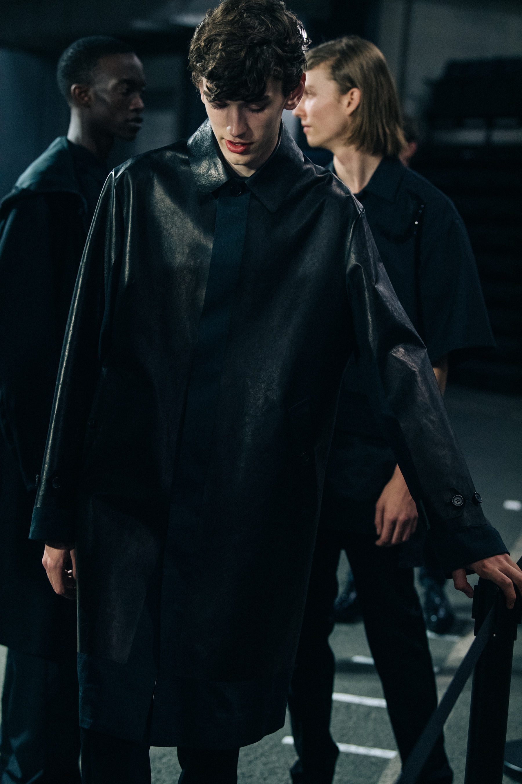 Model wearing black Undercover suit
