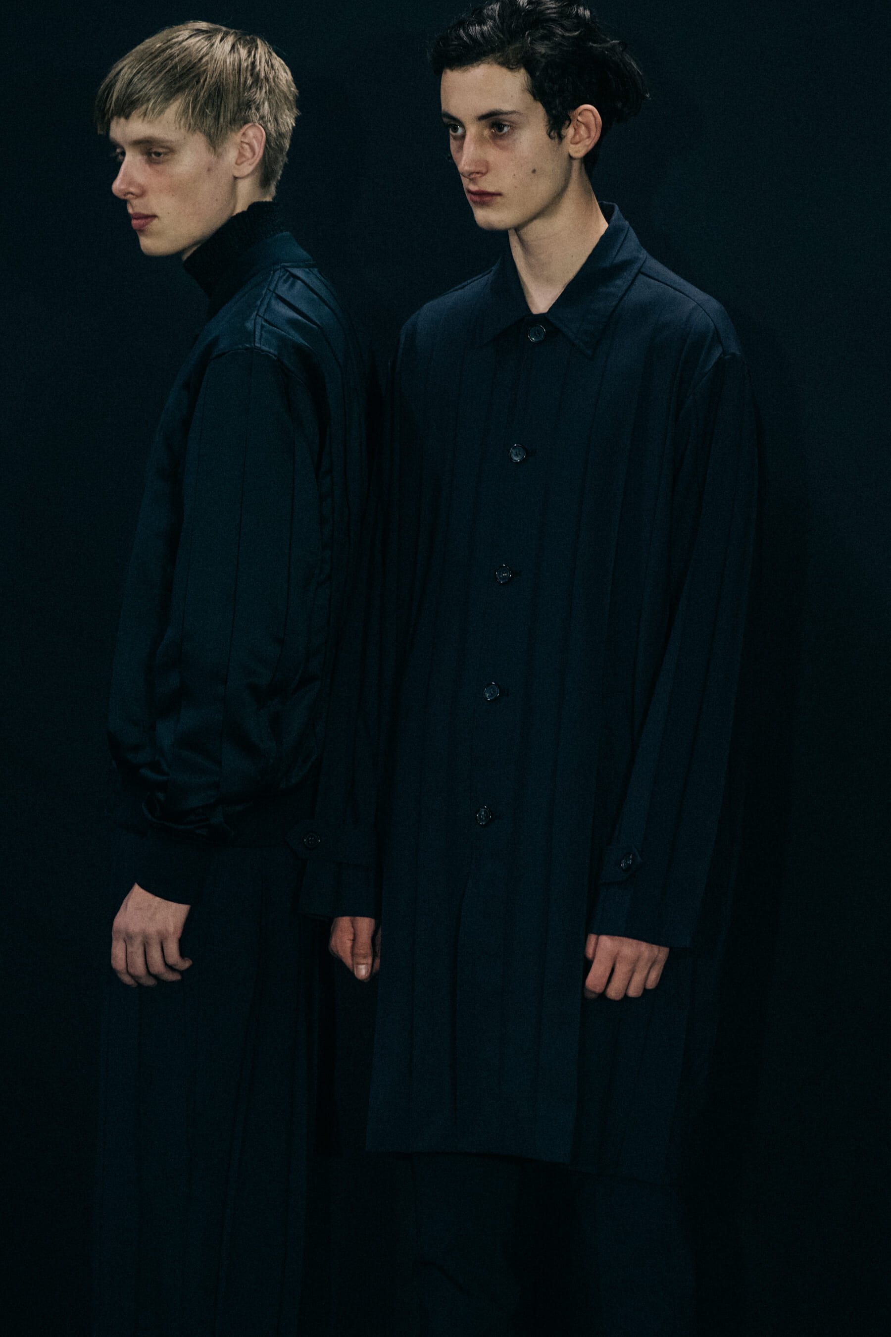 Model wearing black Undercover suit