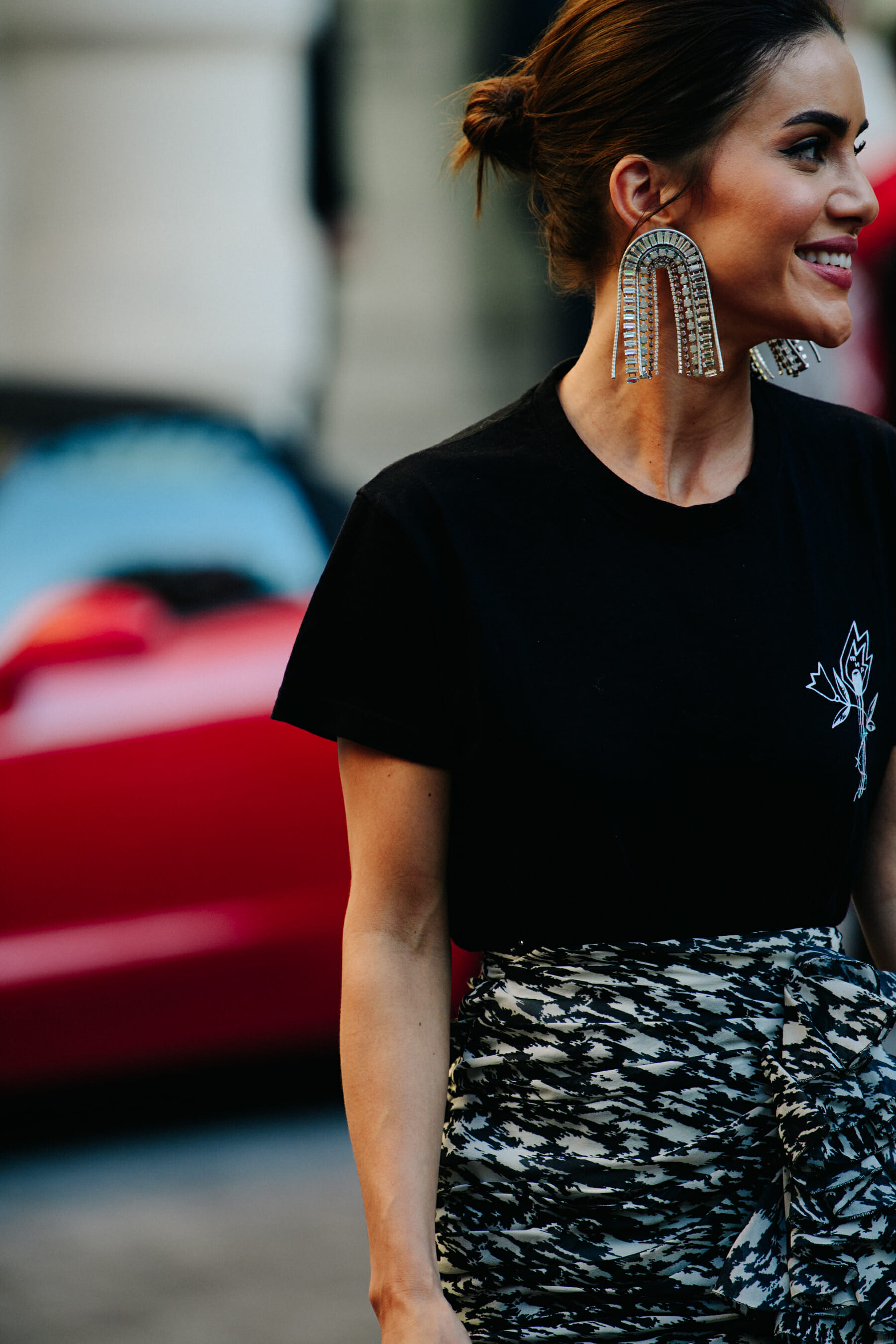 Woman wearing large silver earrings