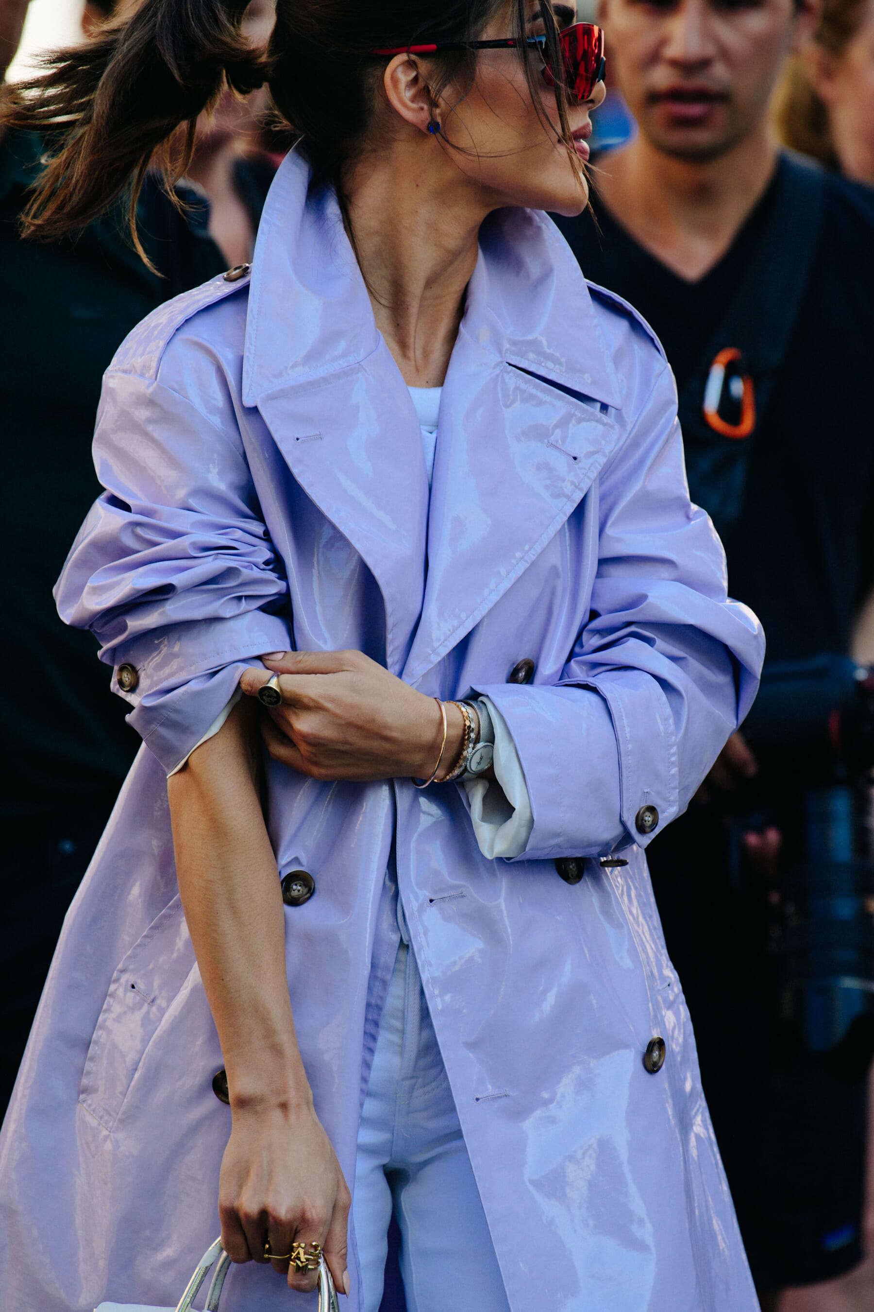 Woman wearing purple patent coat