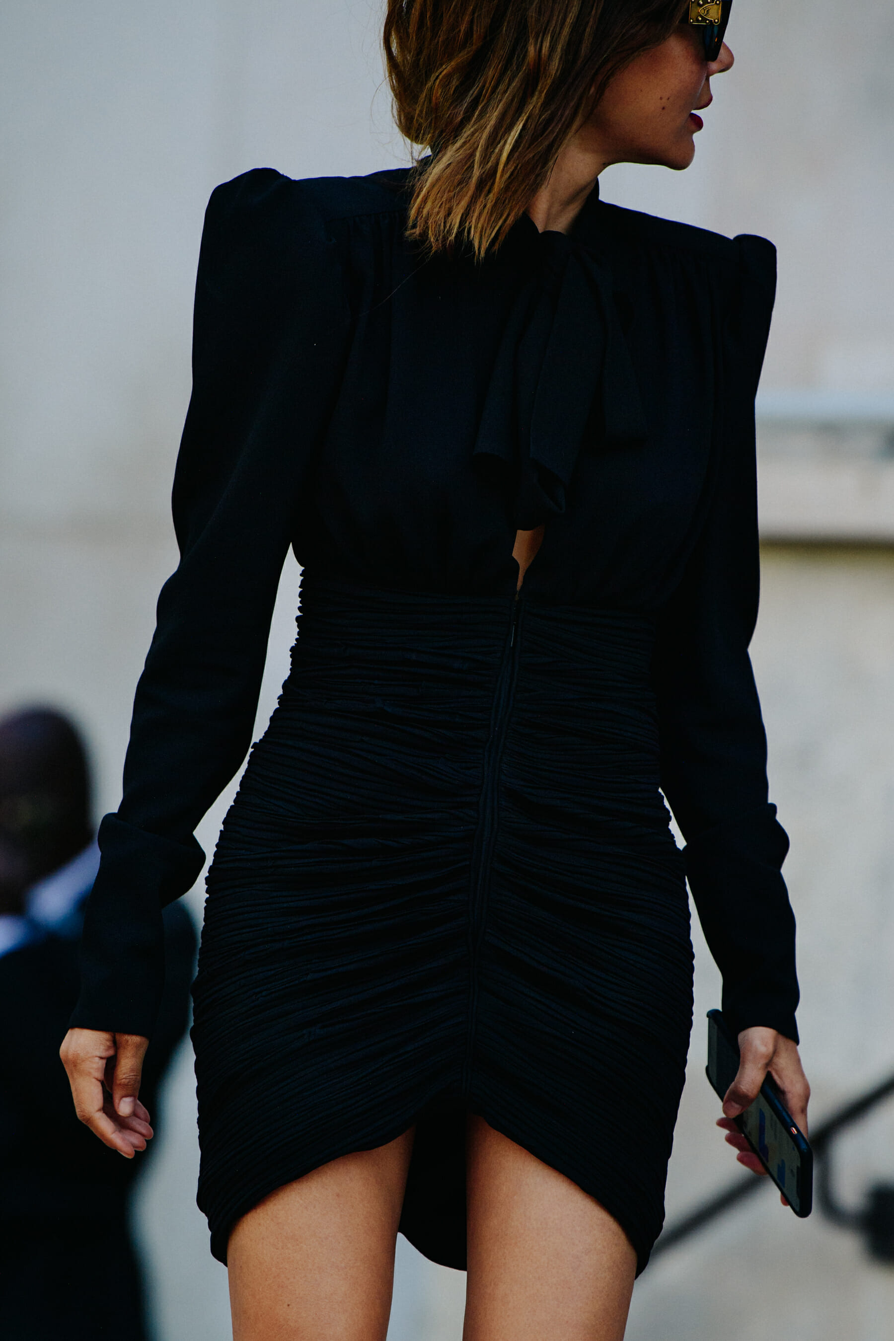 Woman wearing short black dress