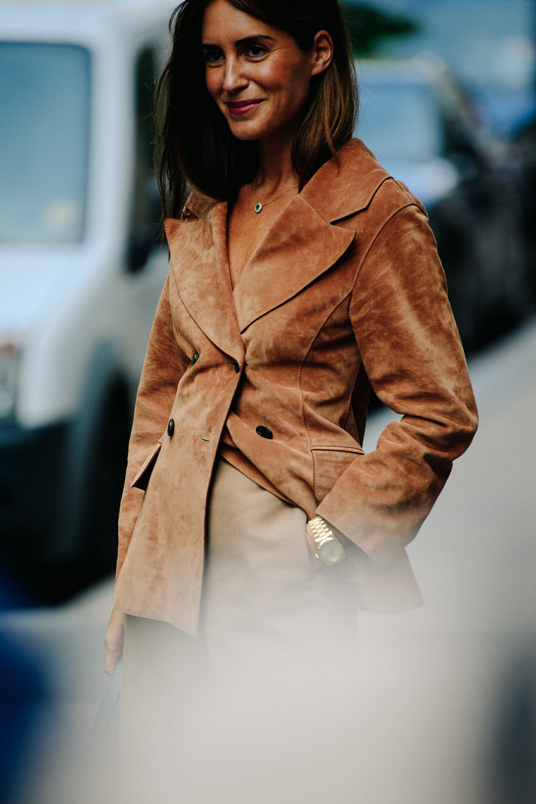 Woman wearing brown suede jacket