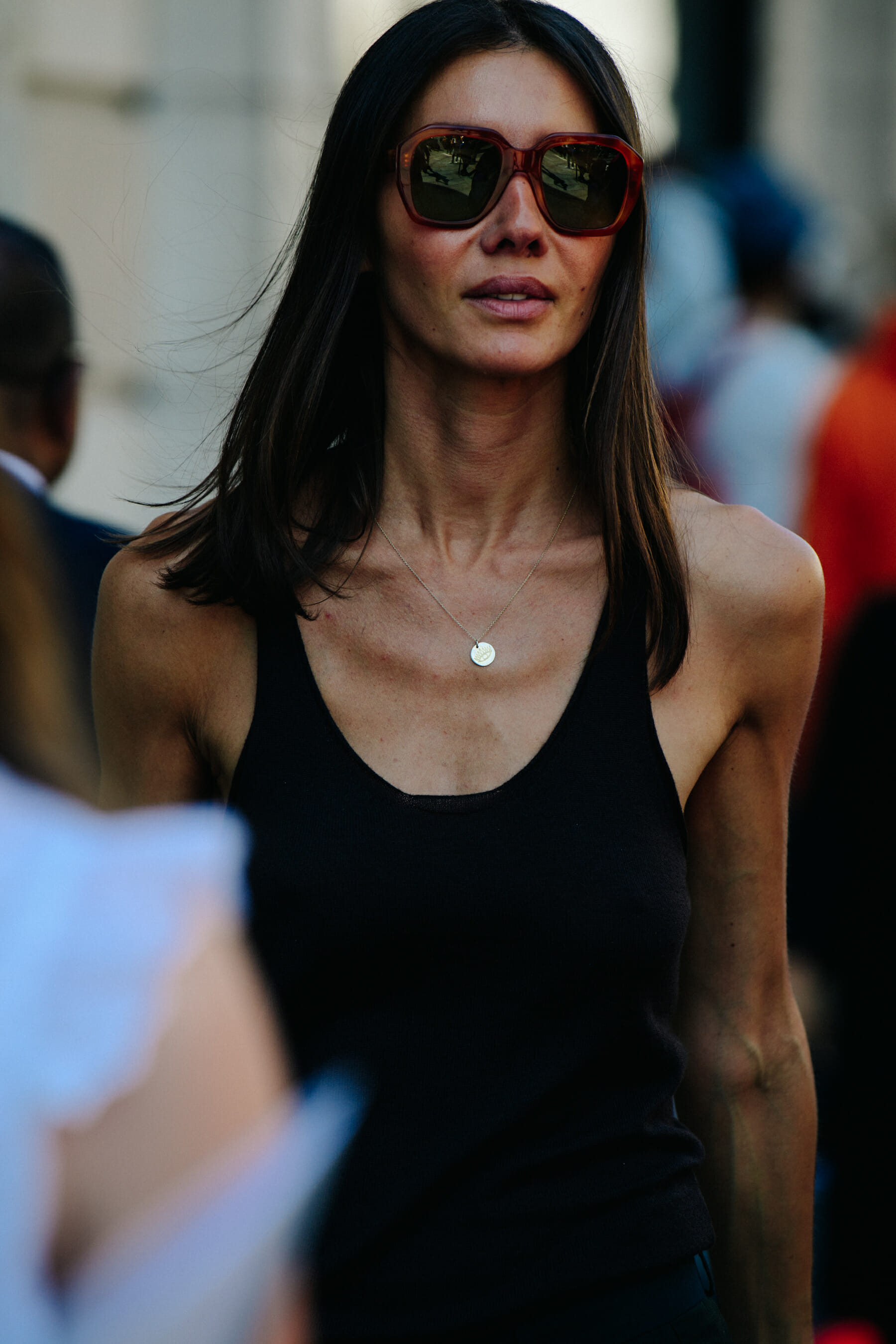 Woman wearing black vest