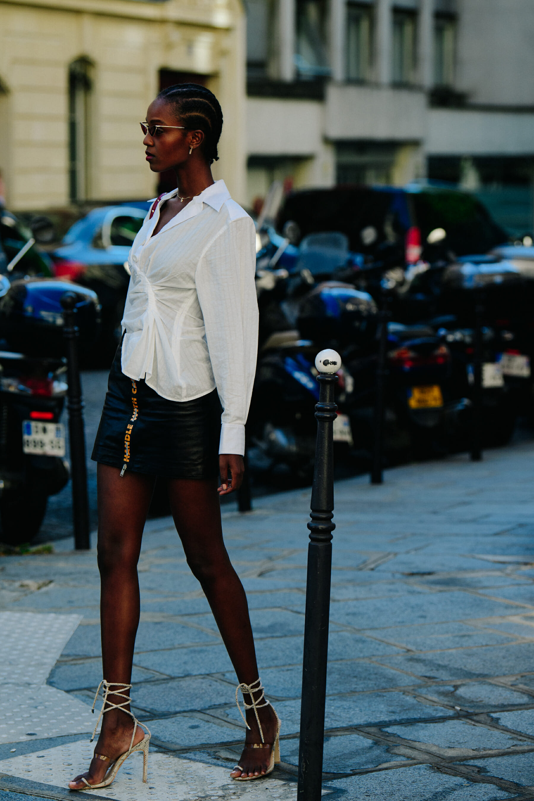 Model wearing short black skirt