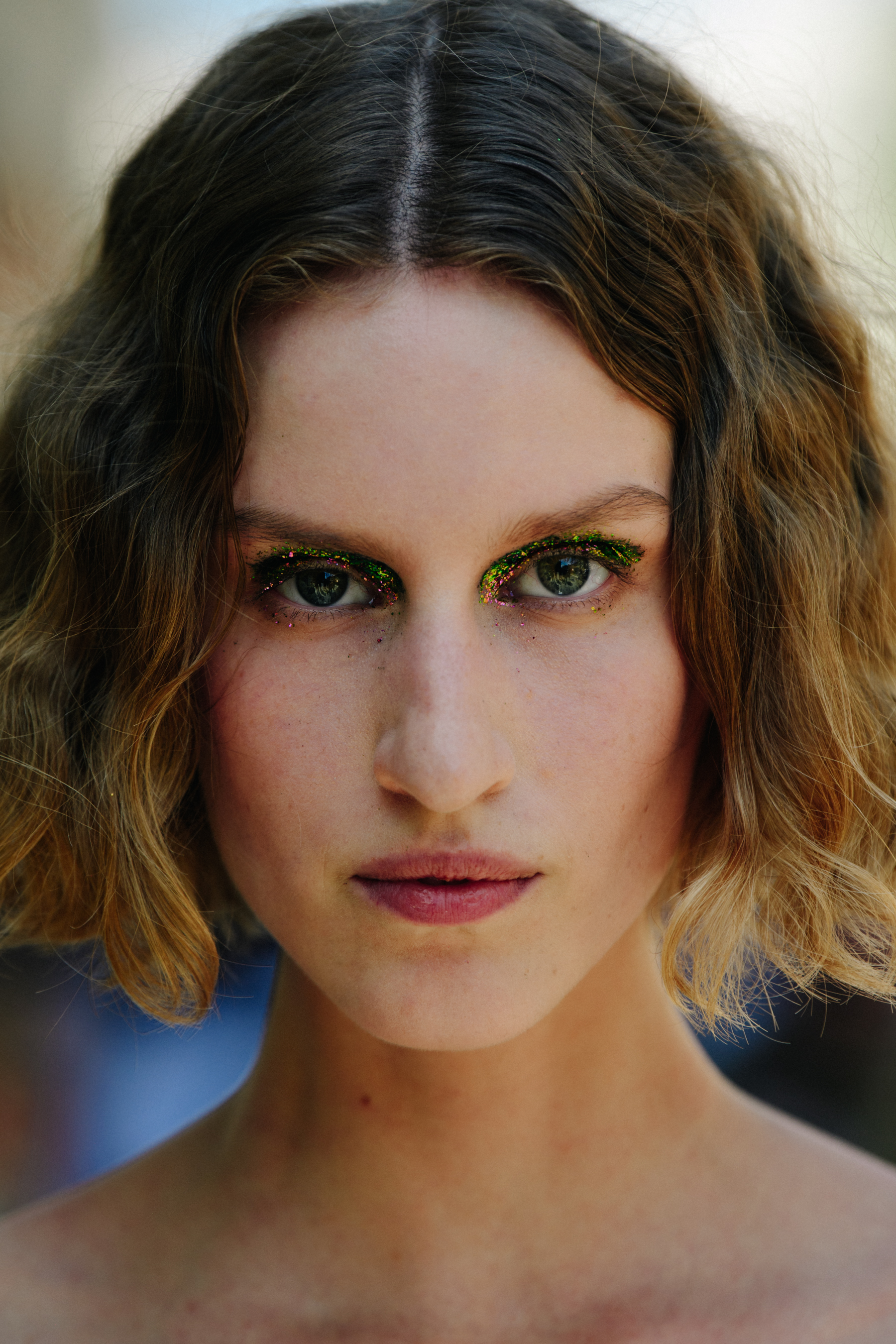 Portrait of model wearing glitter makeup