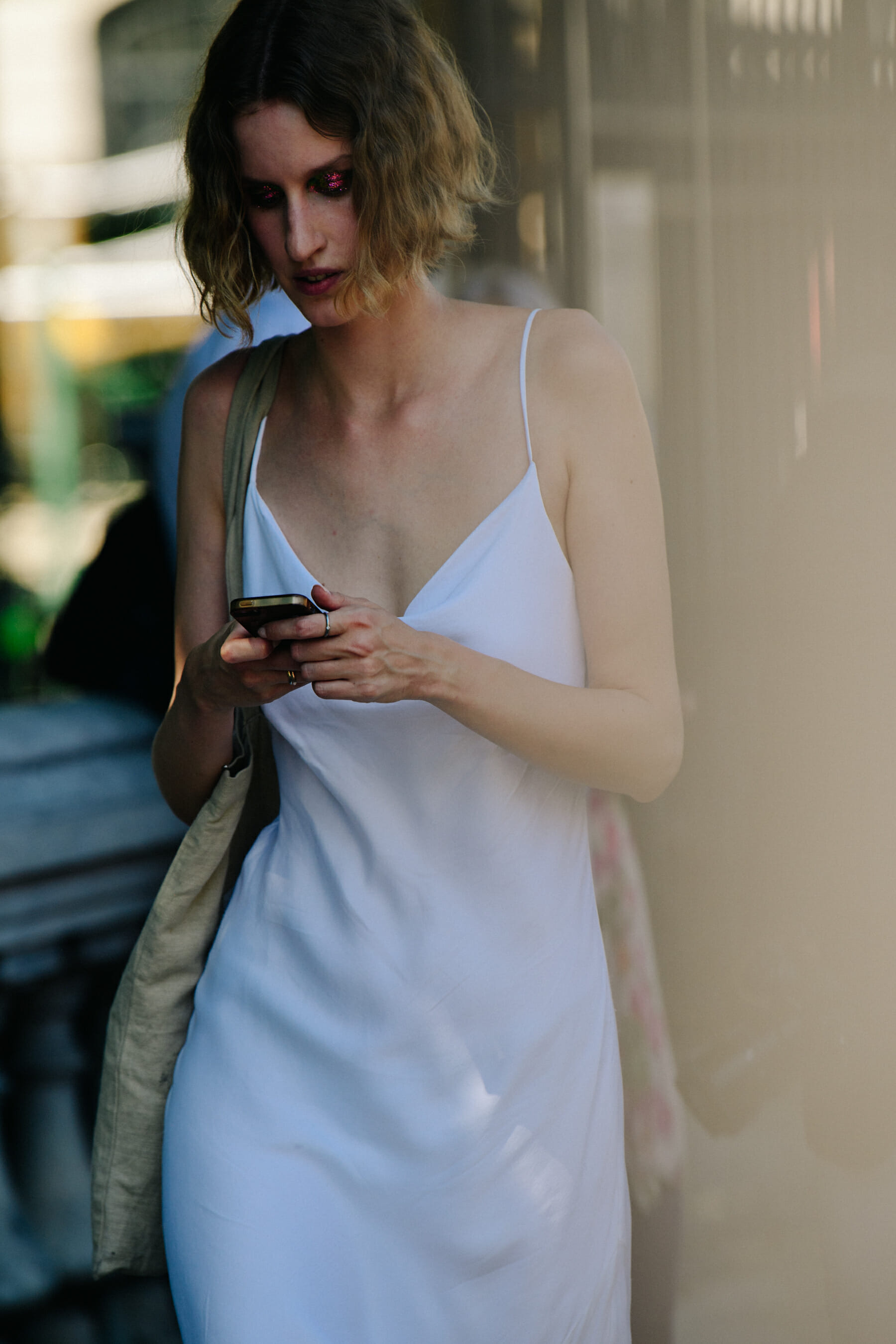 Model wearing white dress