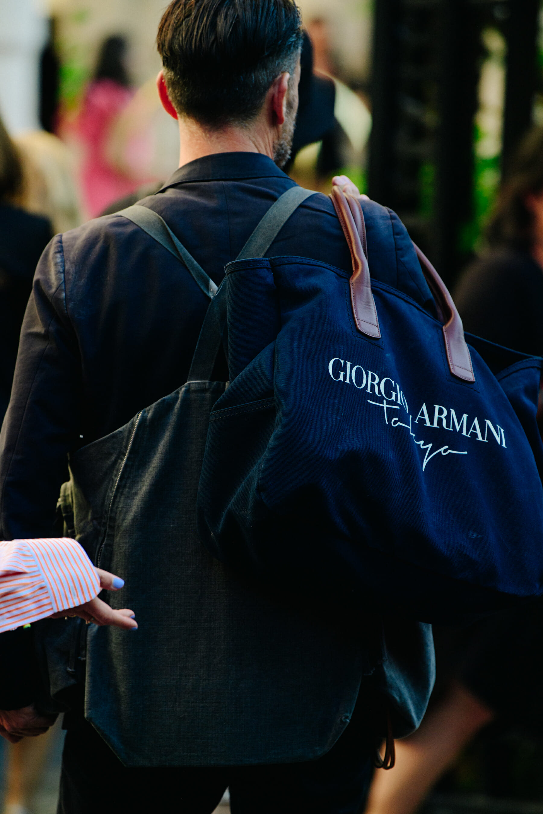 Man carrying Armani bag