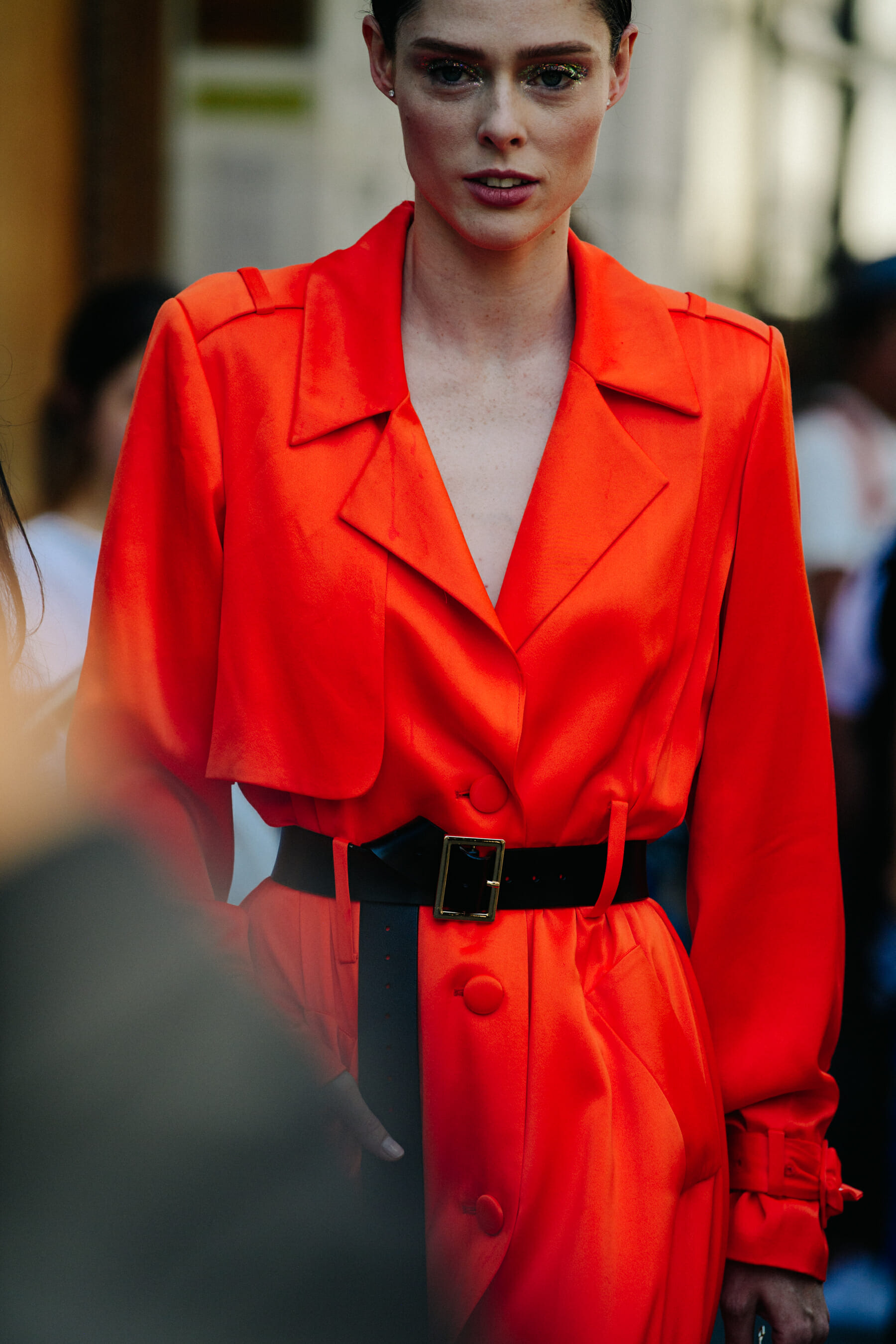 Woman wearing orange coat