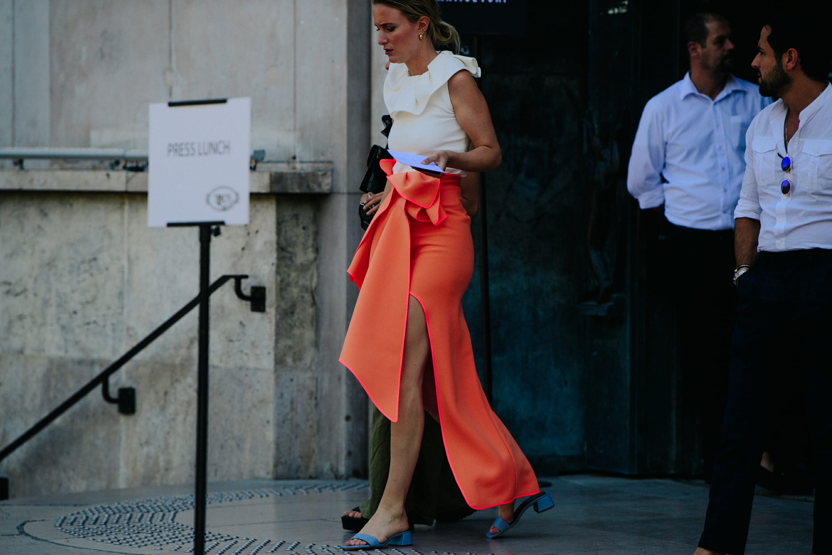 Woman wearing orange skirt