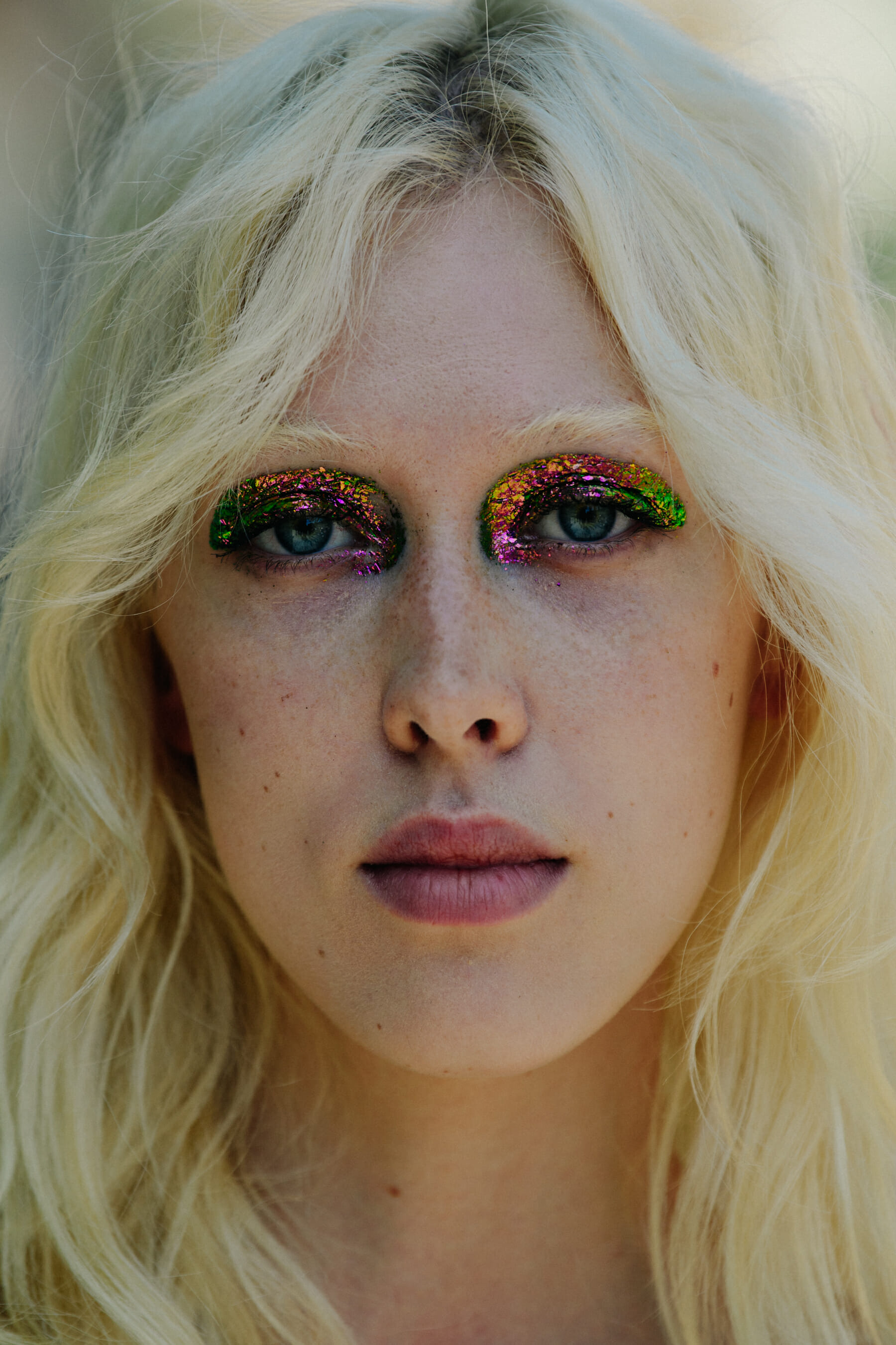 Portrait of model wearing glitter makeup