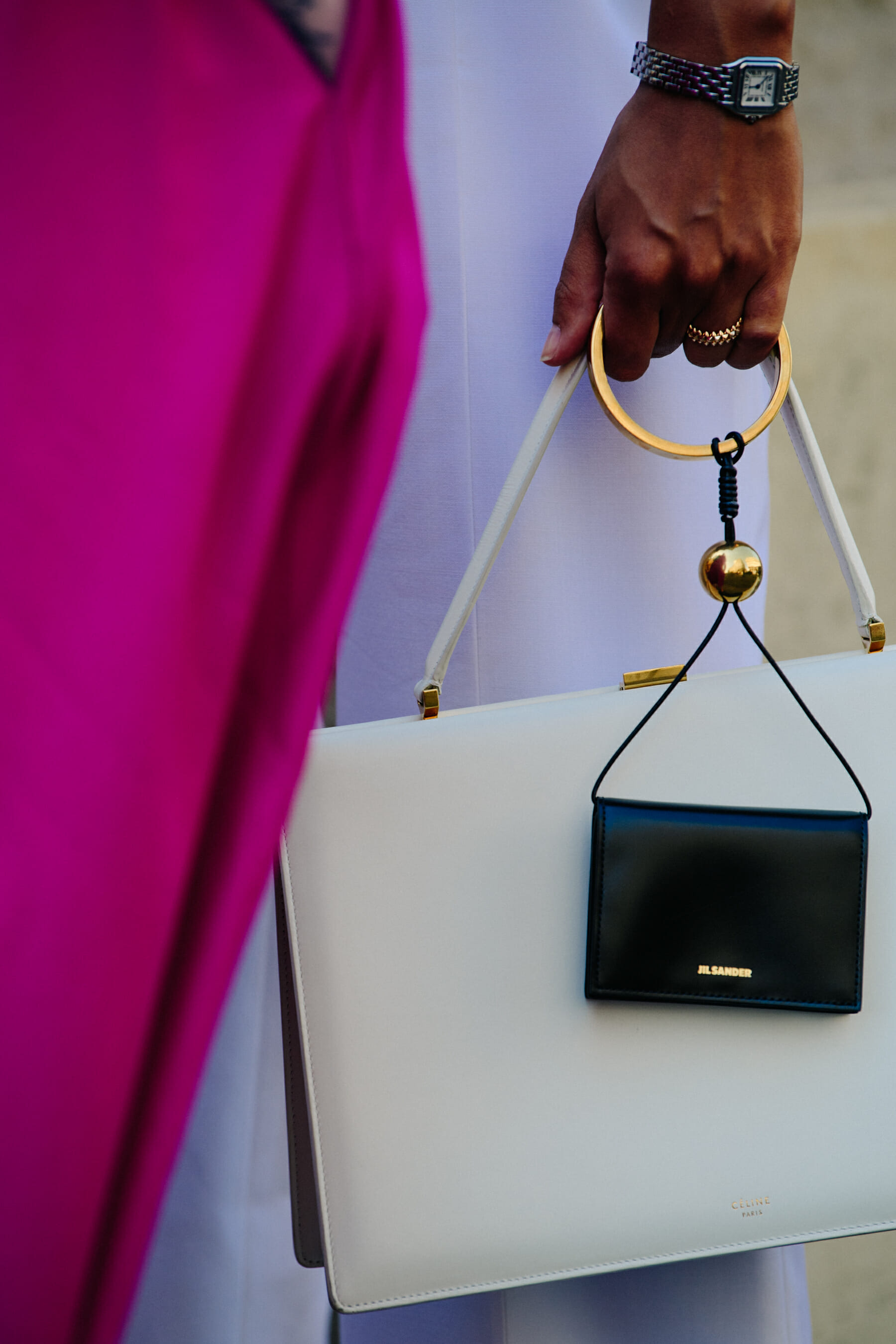 Woman carrying Jil Sander and Celine bag