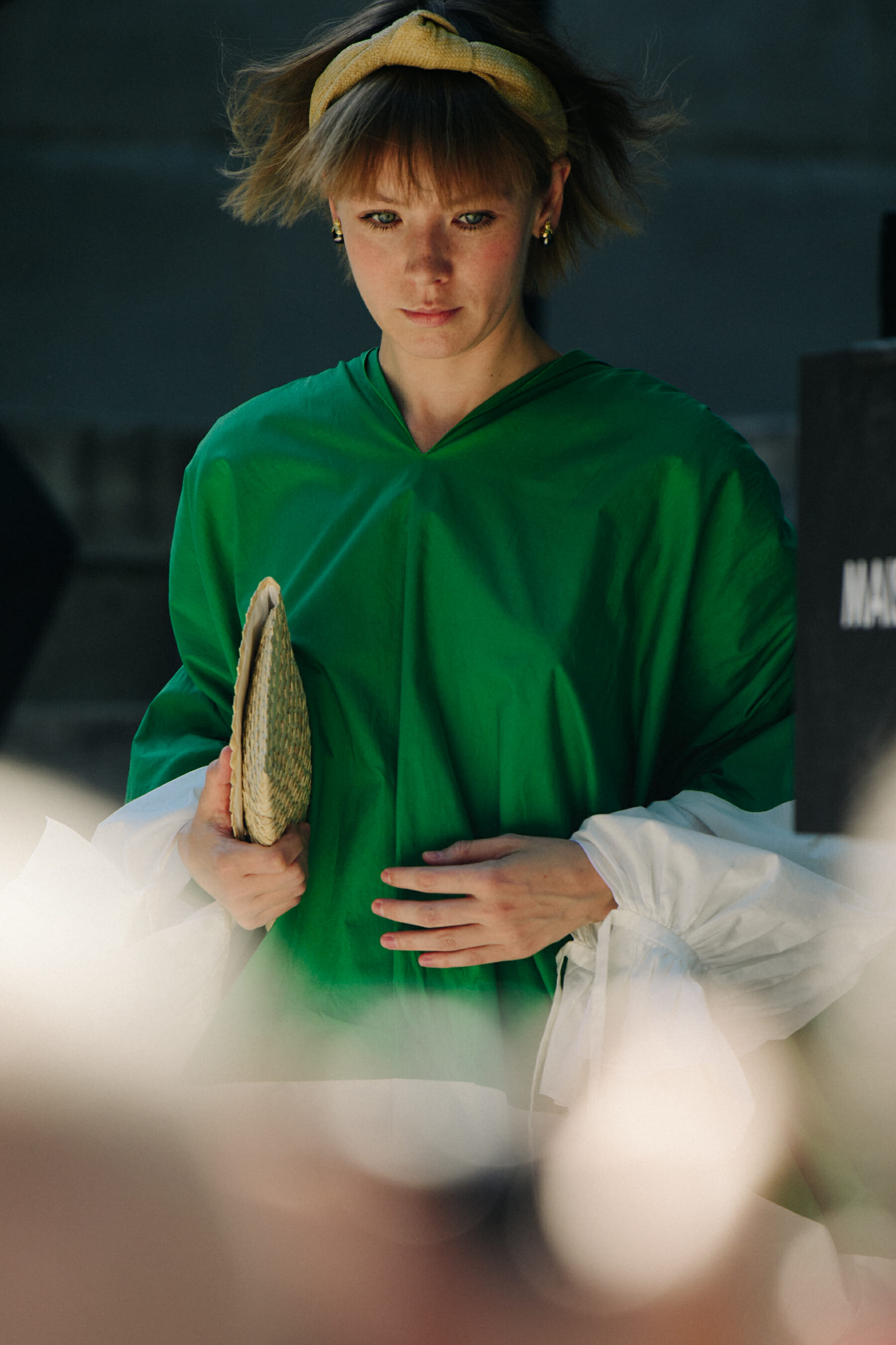 Woman wearing green top