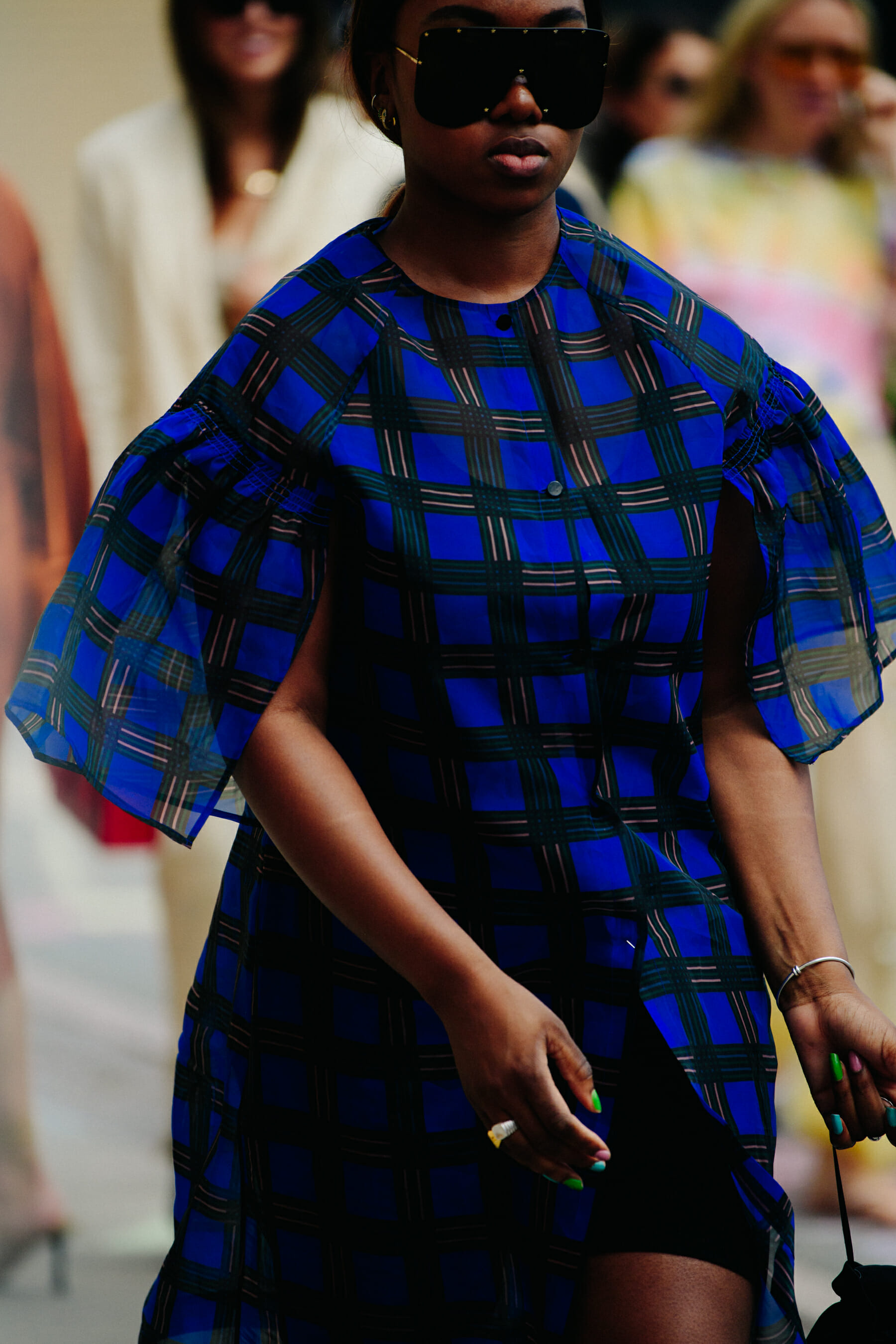 Woman wearing blue check dress