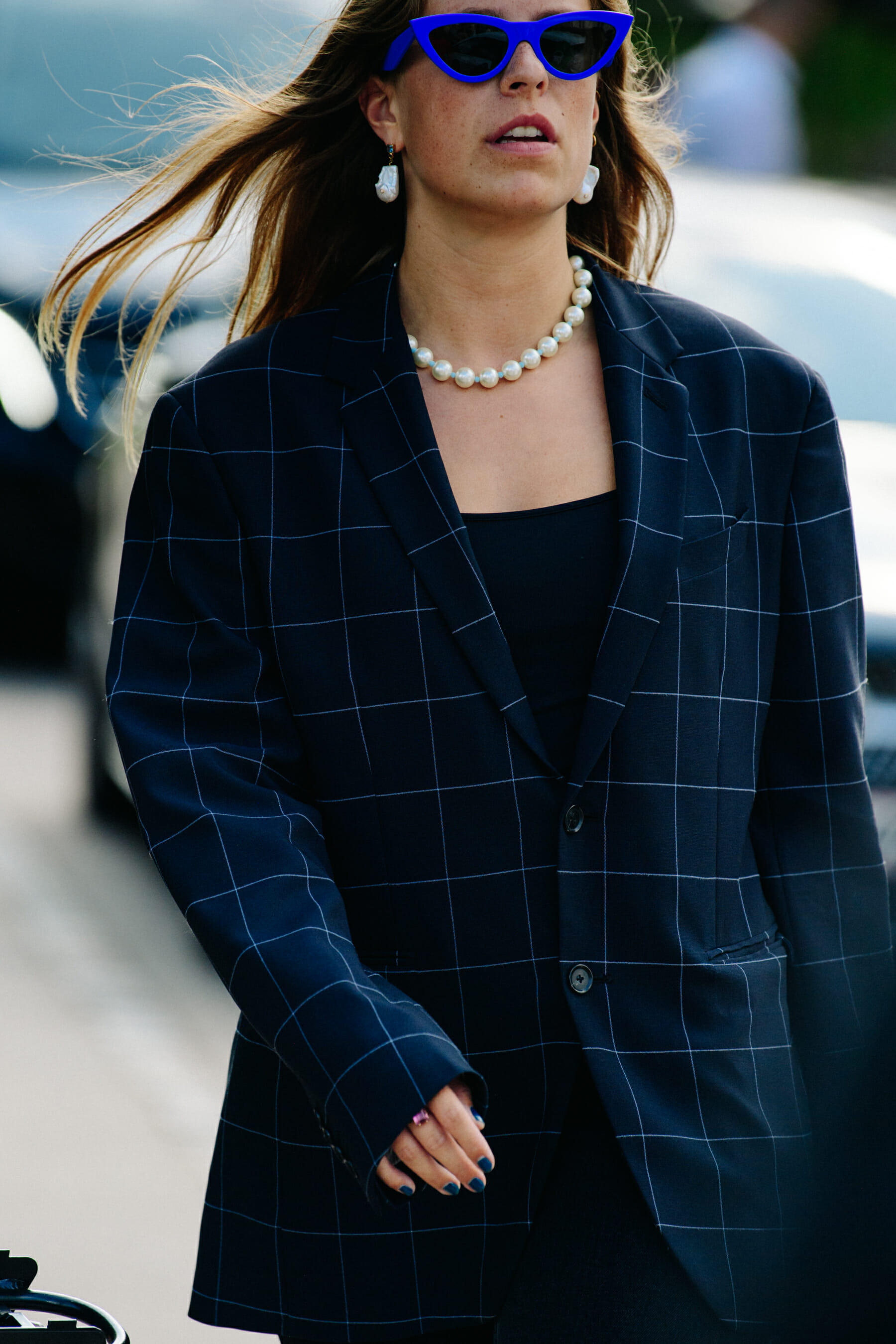 Woman wearing check blazer