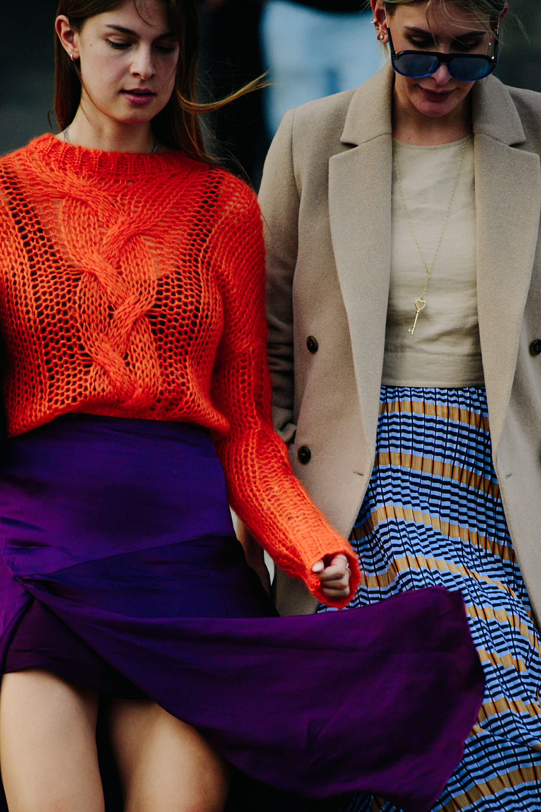 Two women wearing stylish outfits