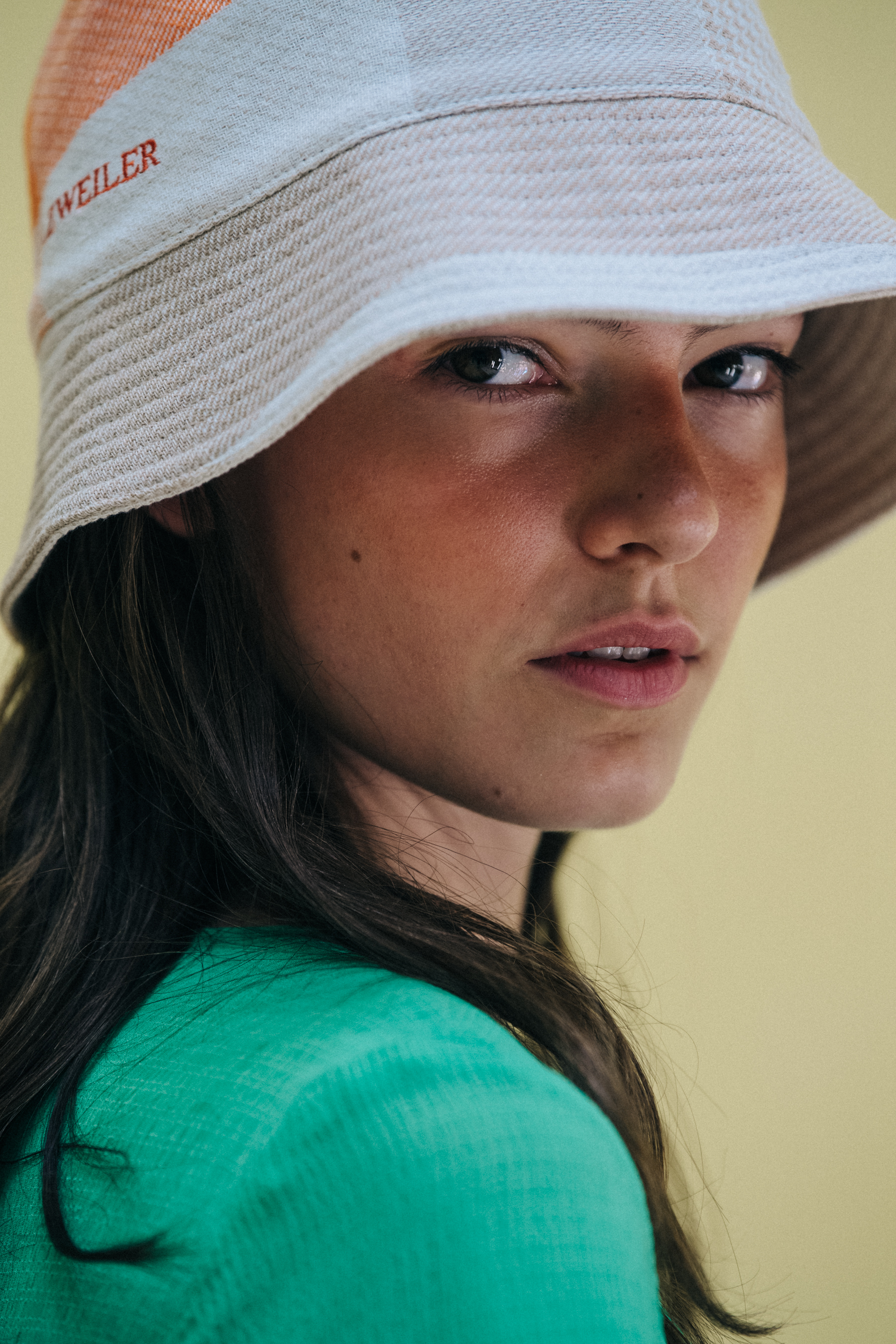 Model wearing hat at Holzweiler
