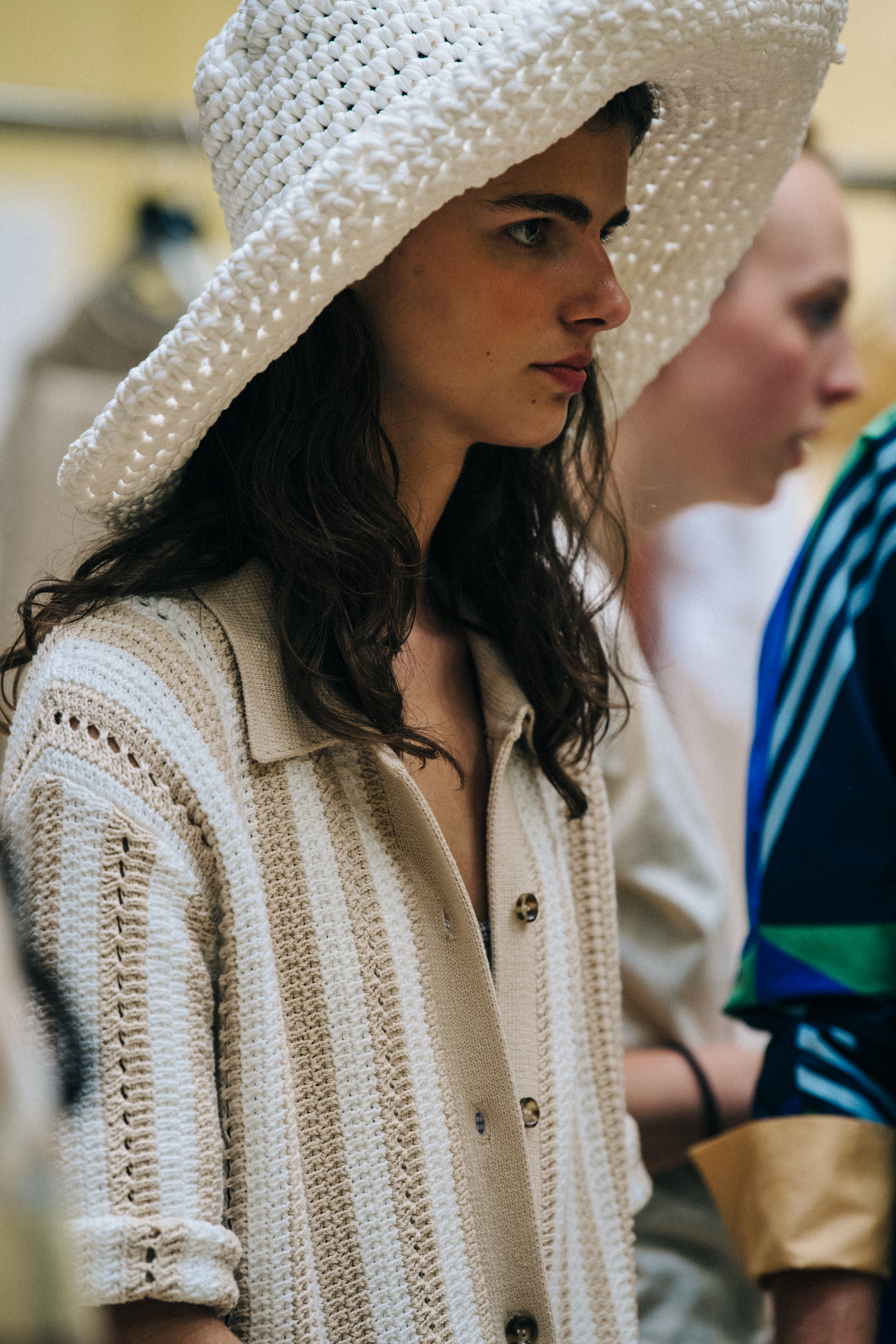 Model wearing hat at Holzweiler