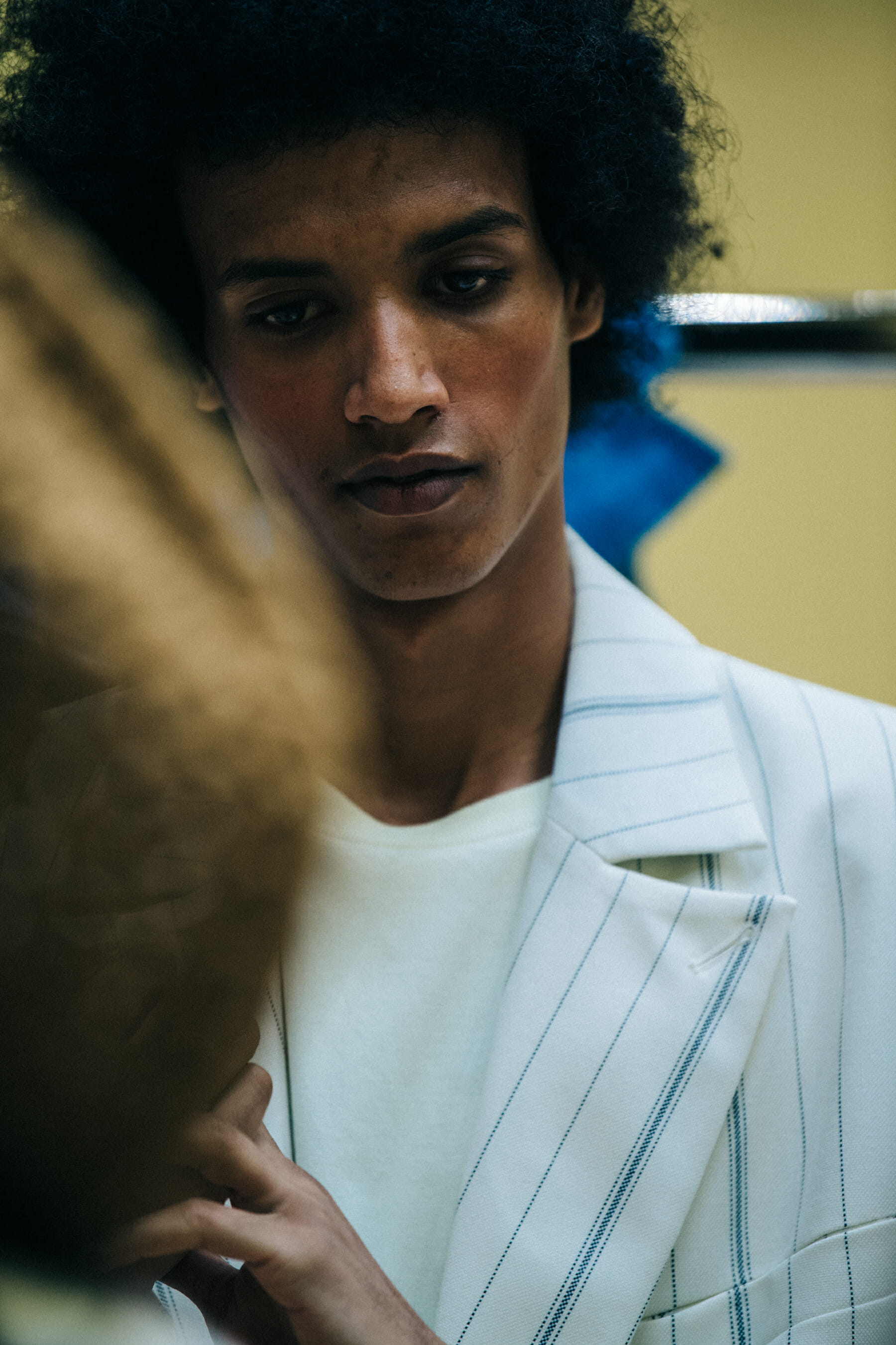 Model wearing light outfit
