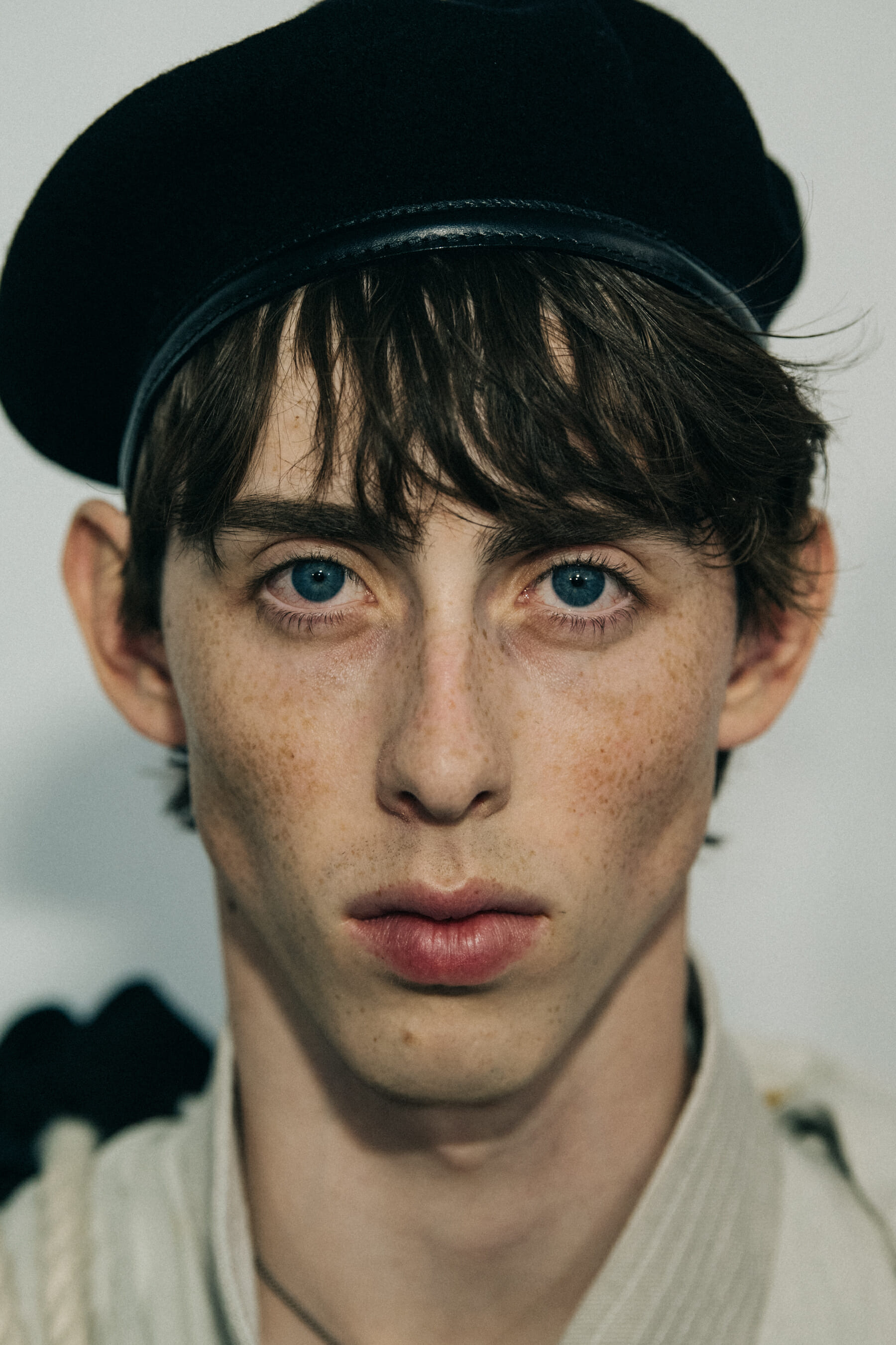 Portrait of model wearing black hat