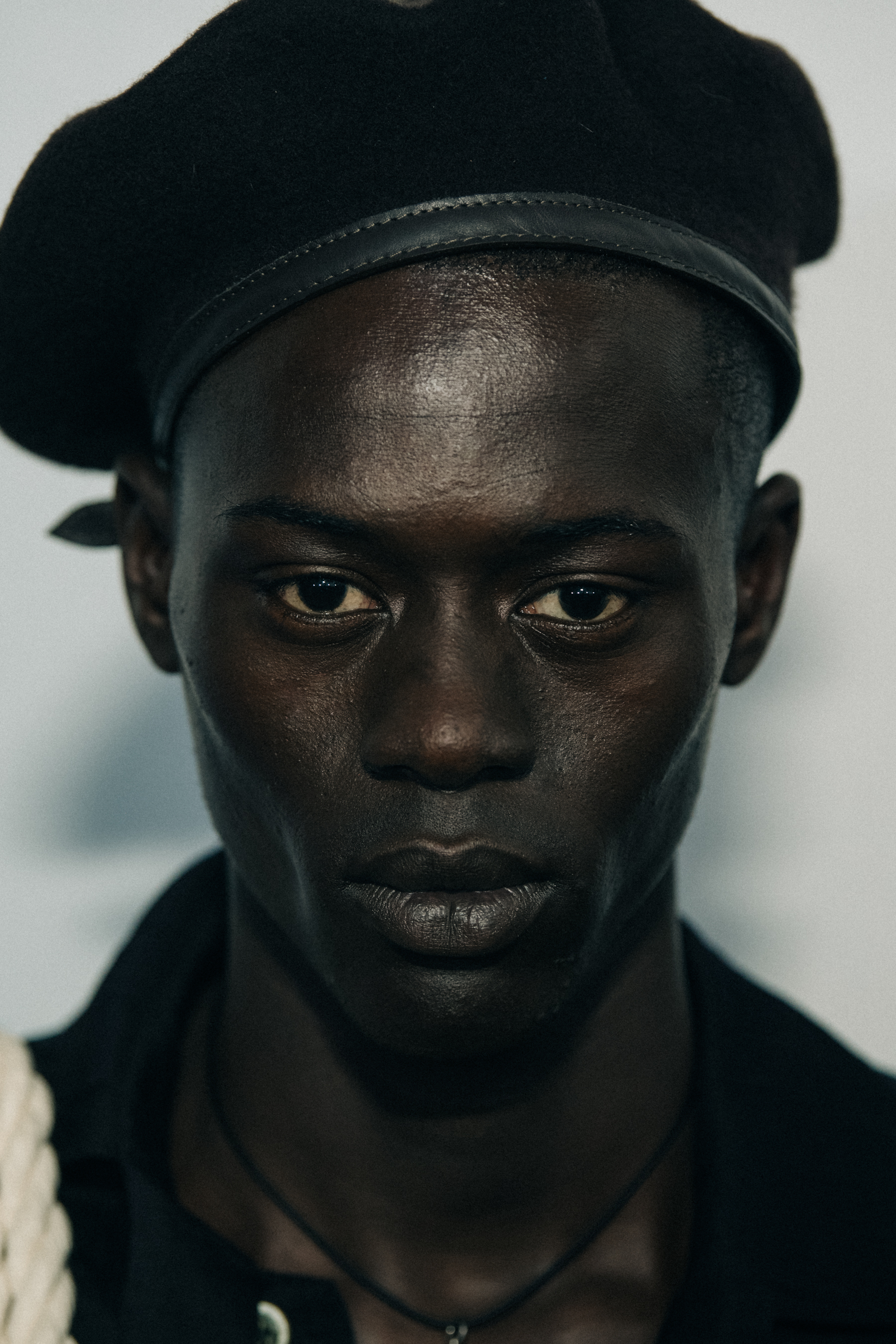 Portrait of model wearing black hat