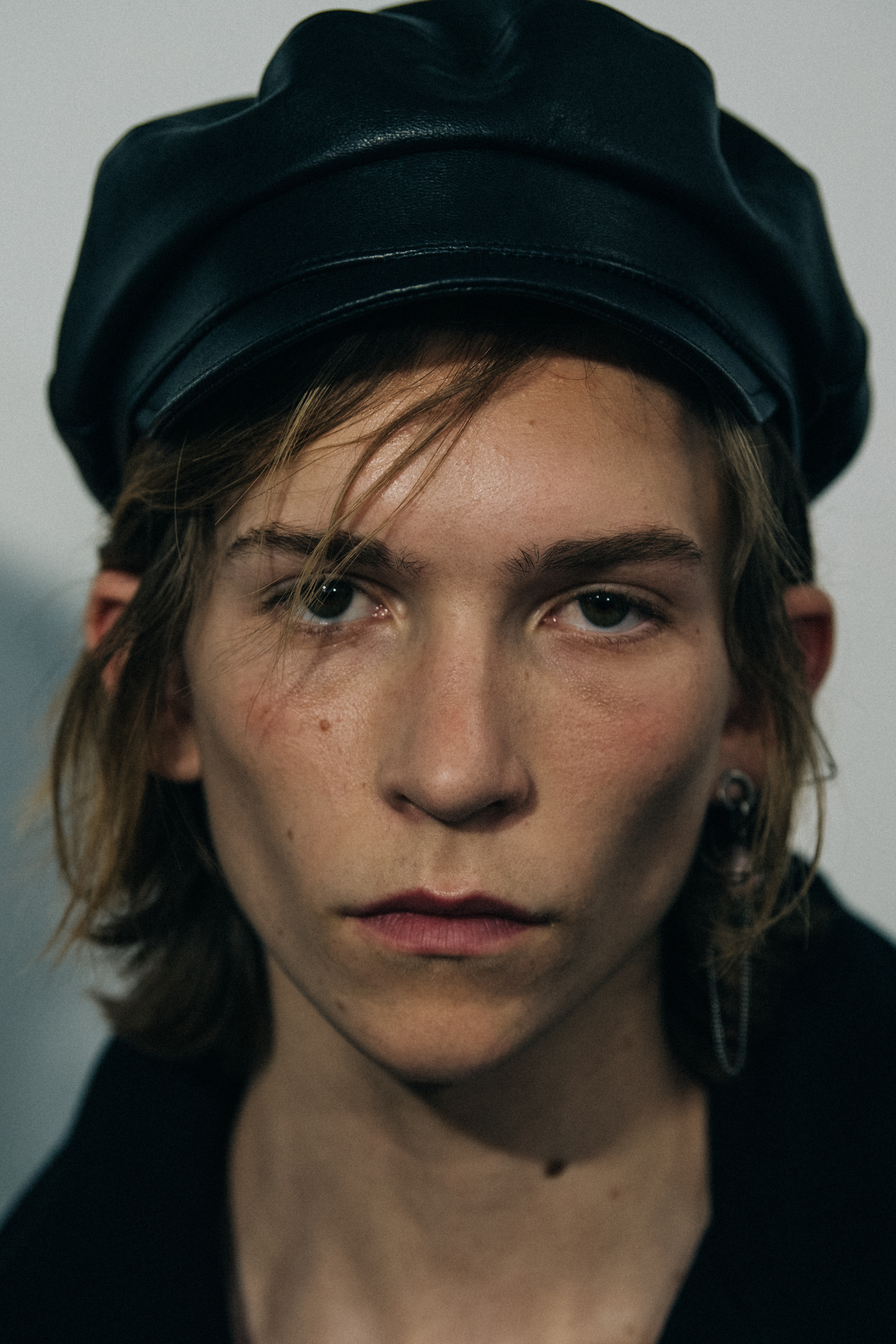 Portrait of model wearing black hat