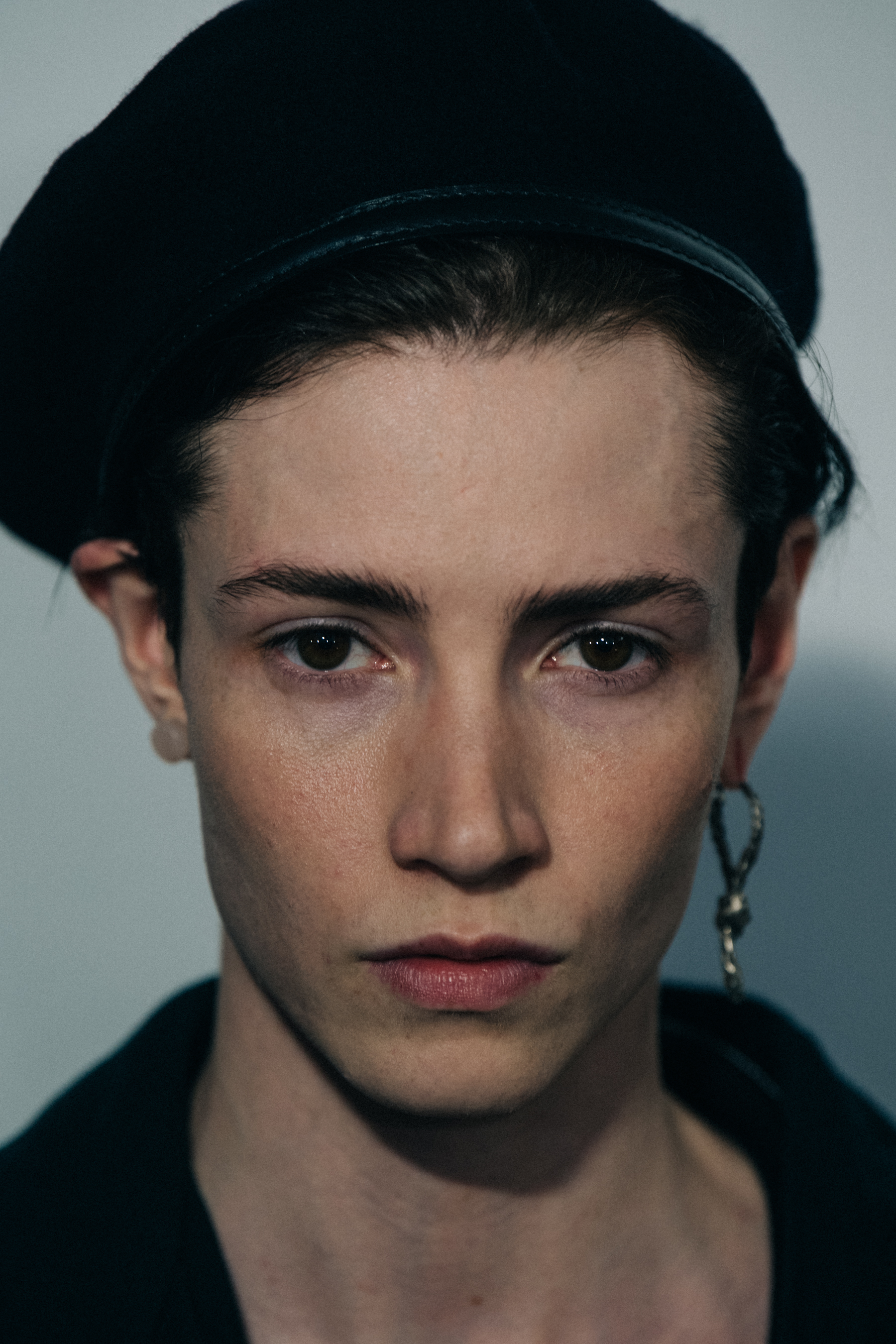 Portrait of model wearing black hat