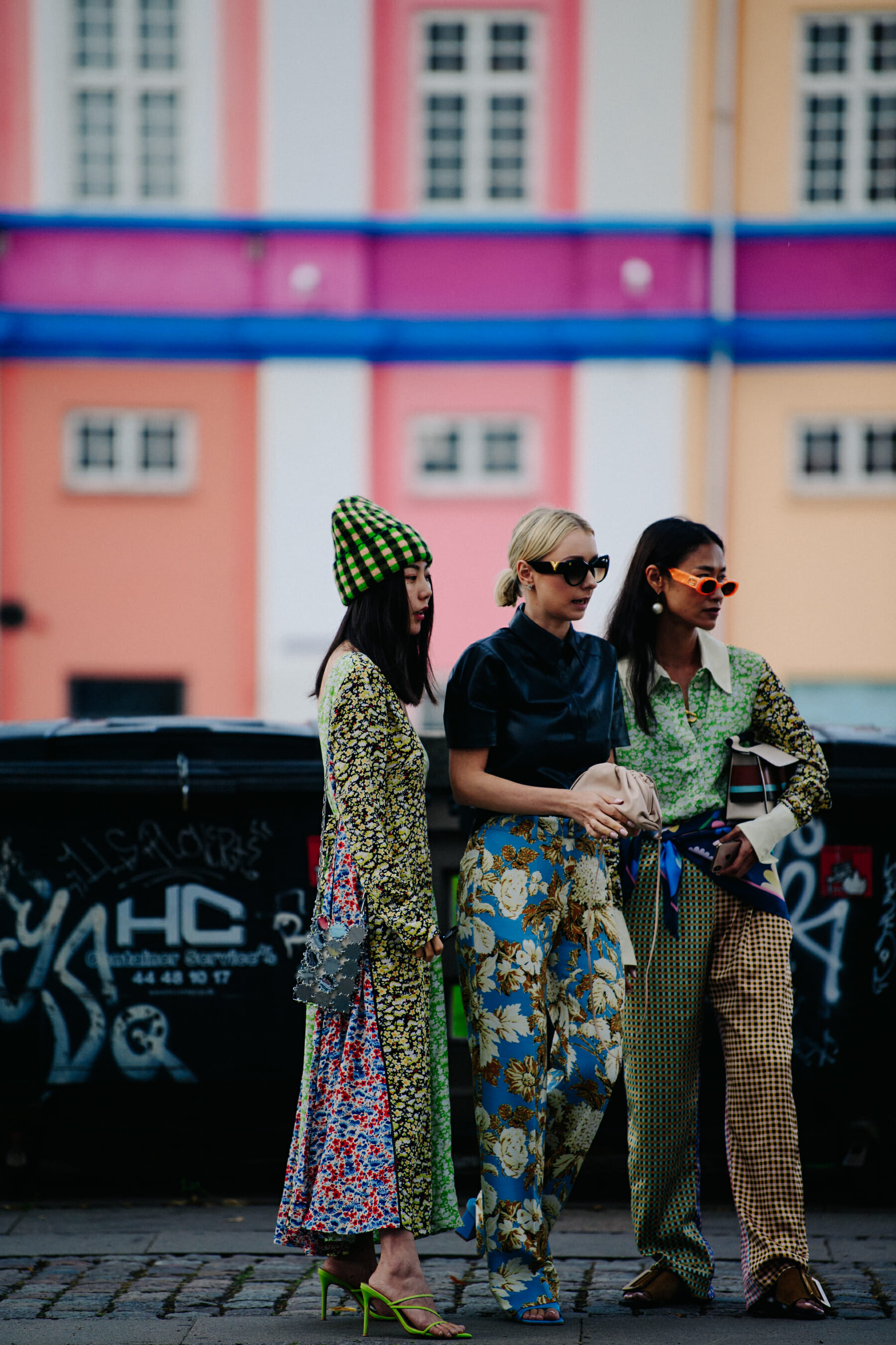 Three women wearing patterns