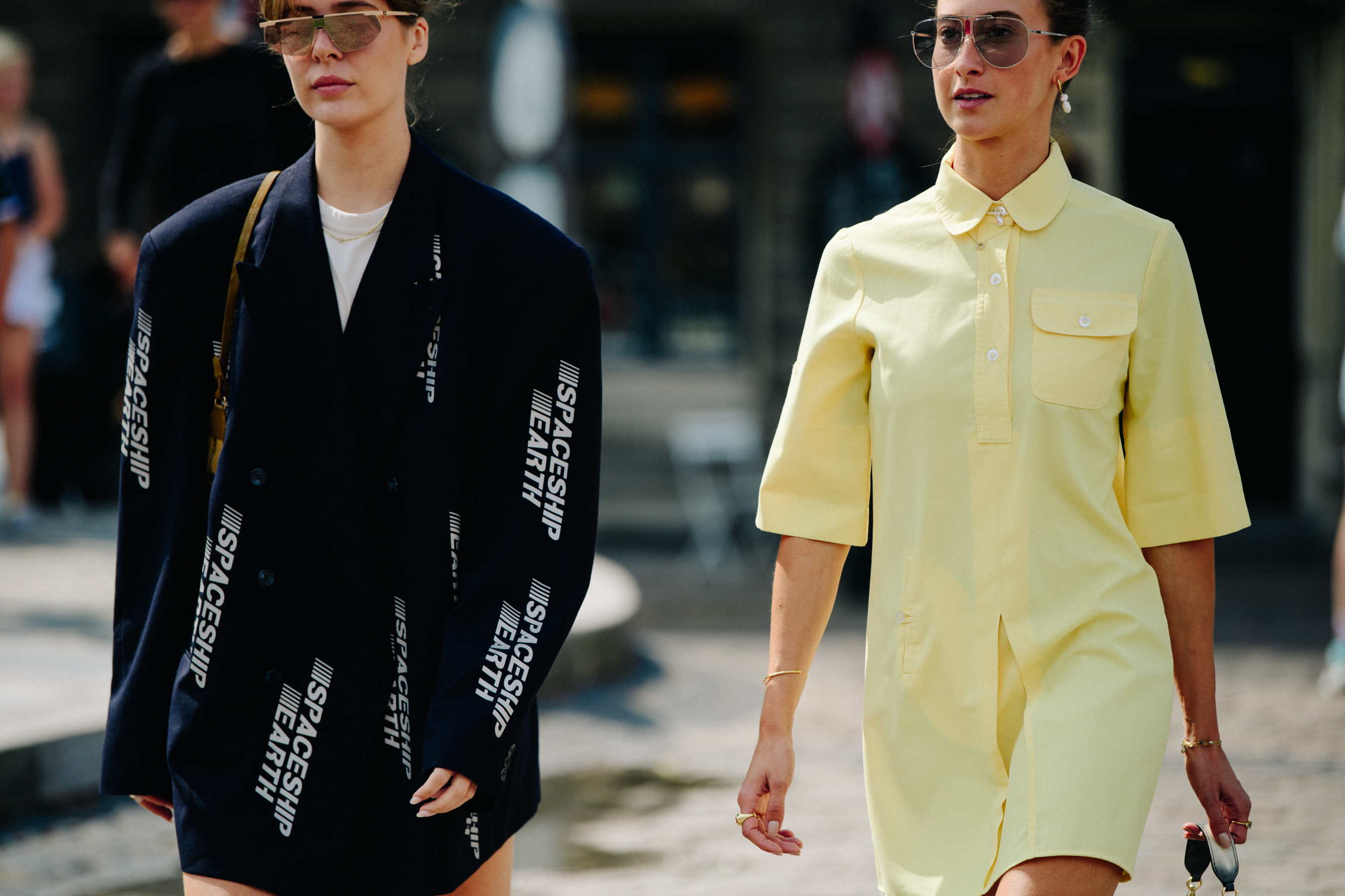 Two women wearing yellow and black