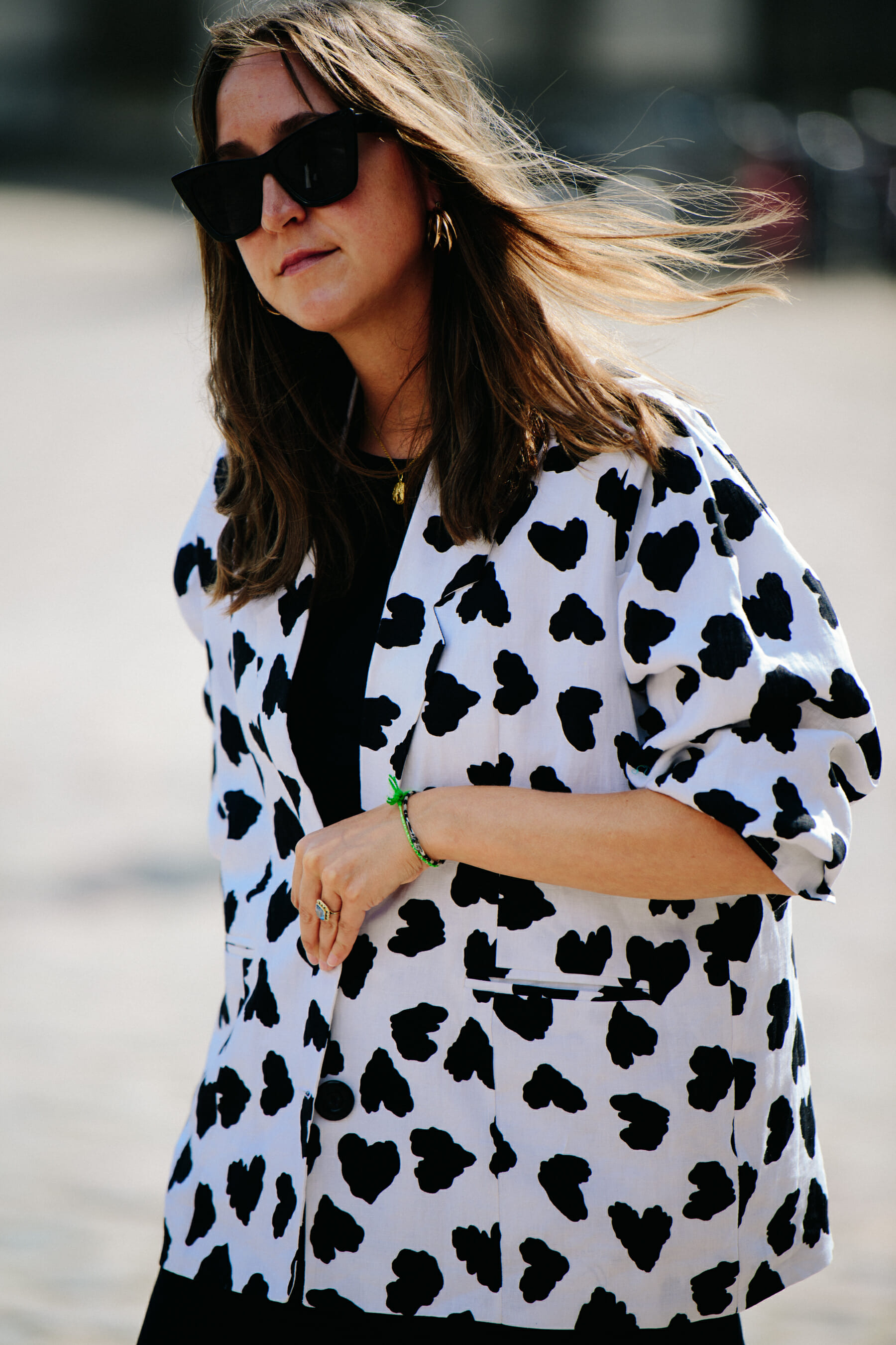 Woman wearing white and black jacket