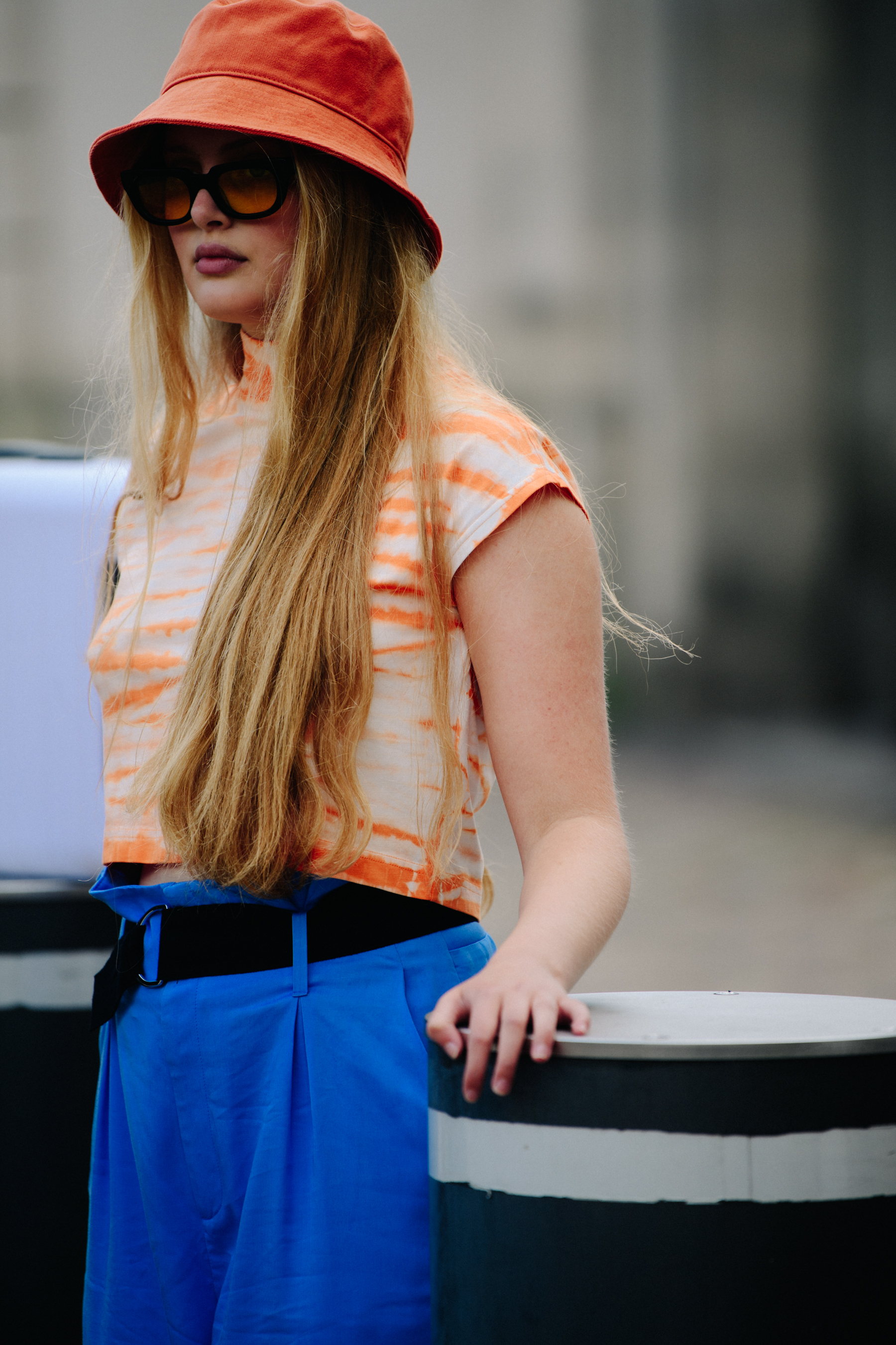 Woman wearing orange bucket hat