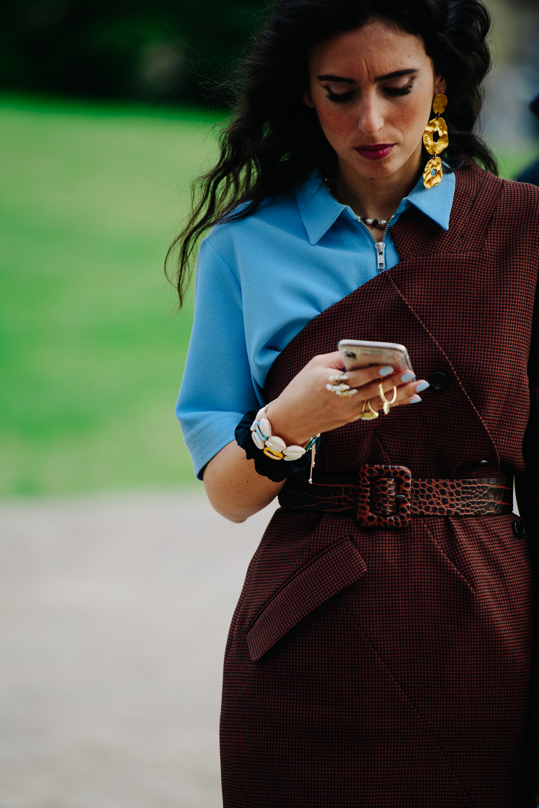 Woman wearing blue and brown top