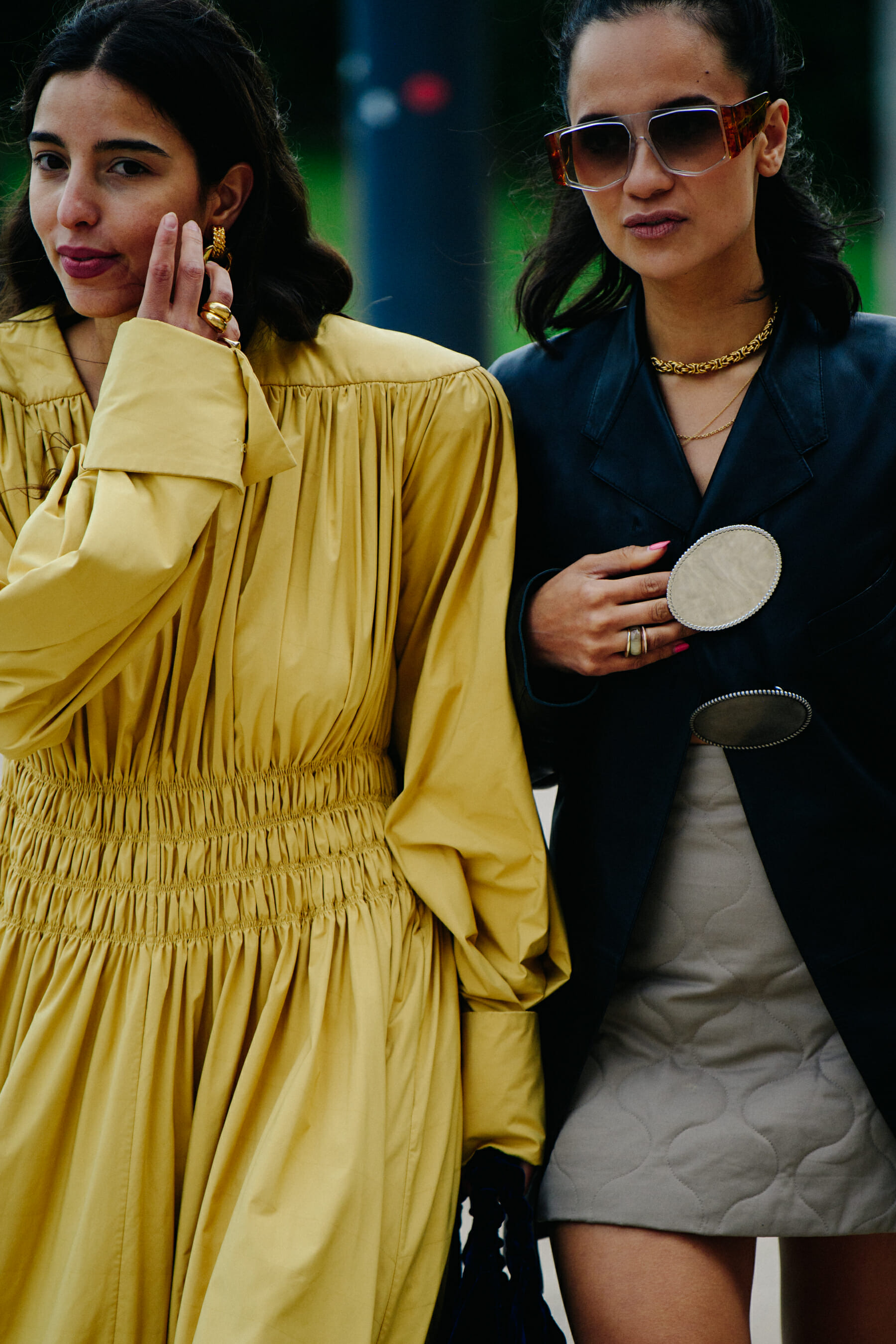Two women wearing stylish outfits