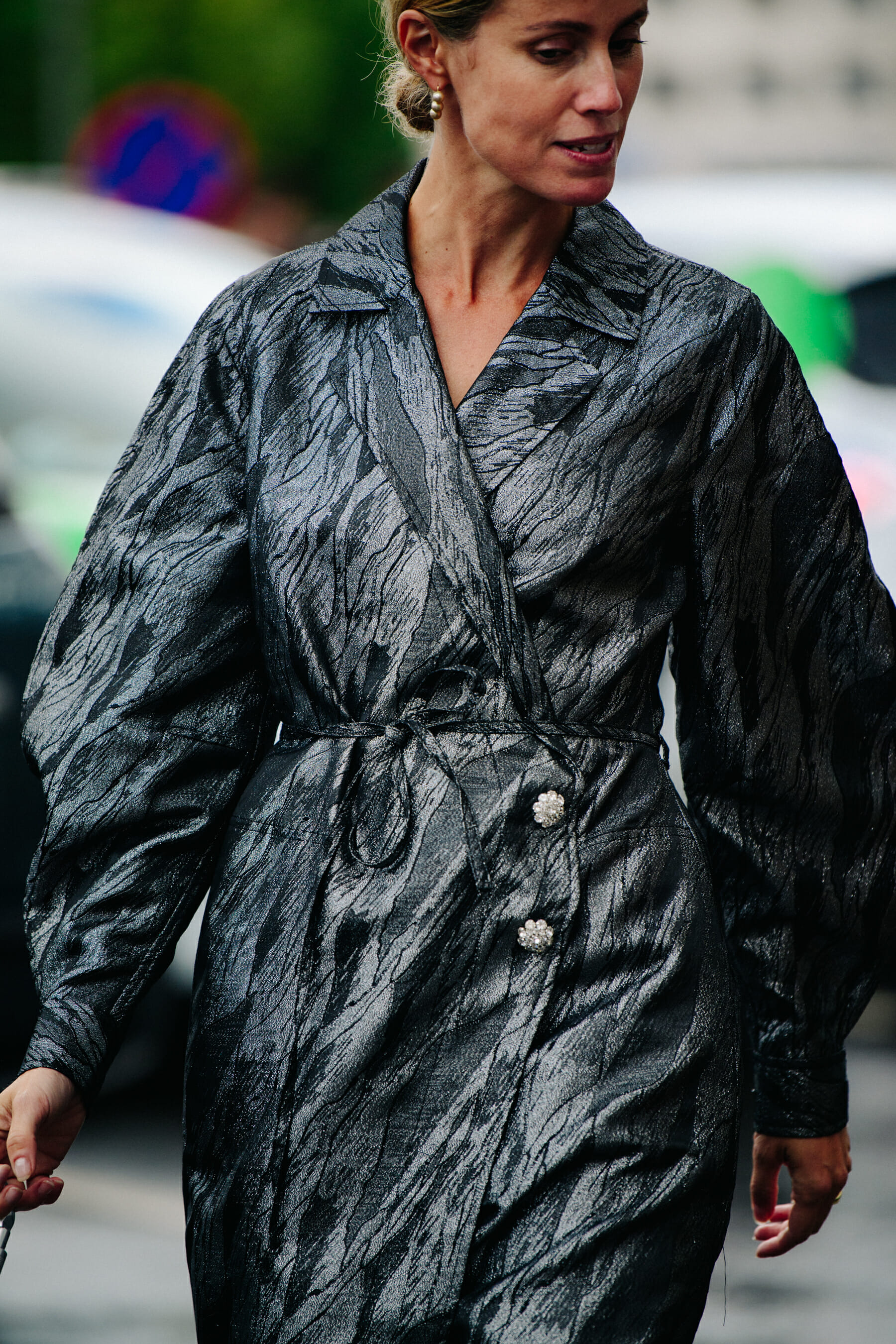 Woman wearing silver coat