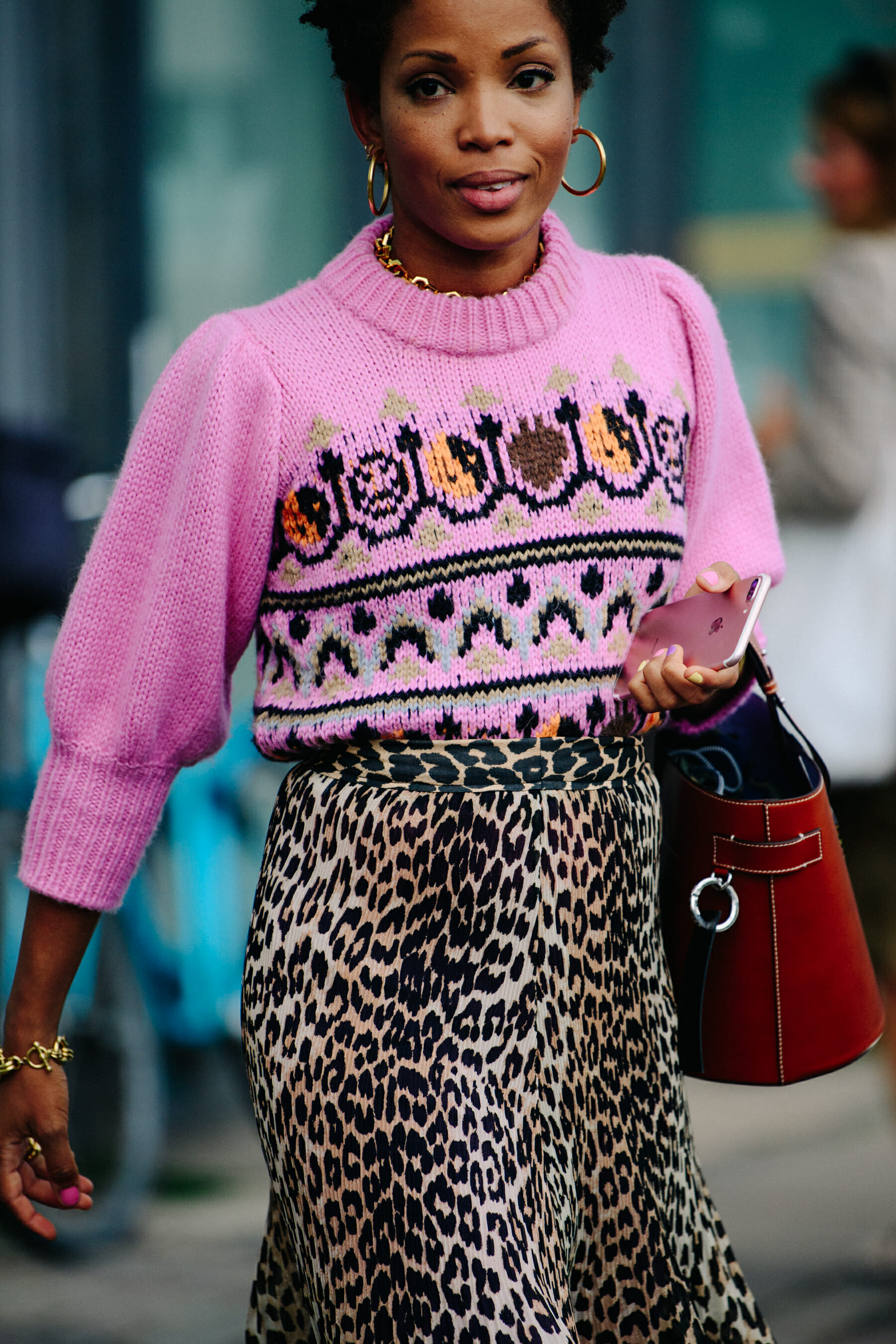 Woman wearing pink wool jumper