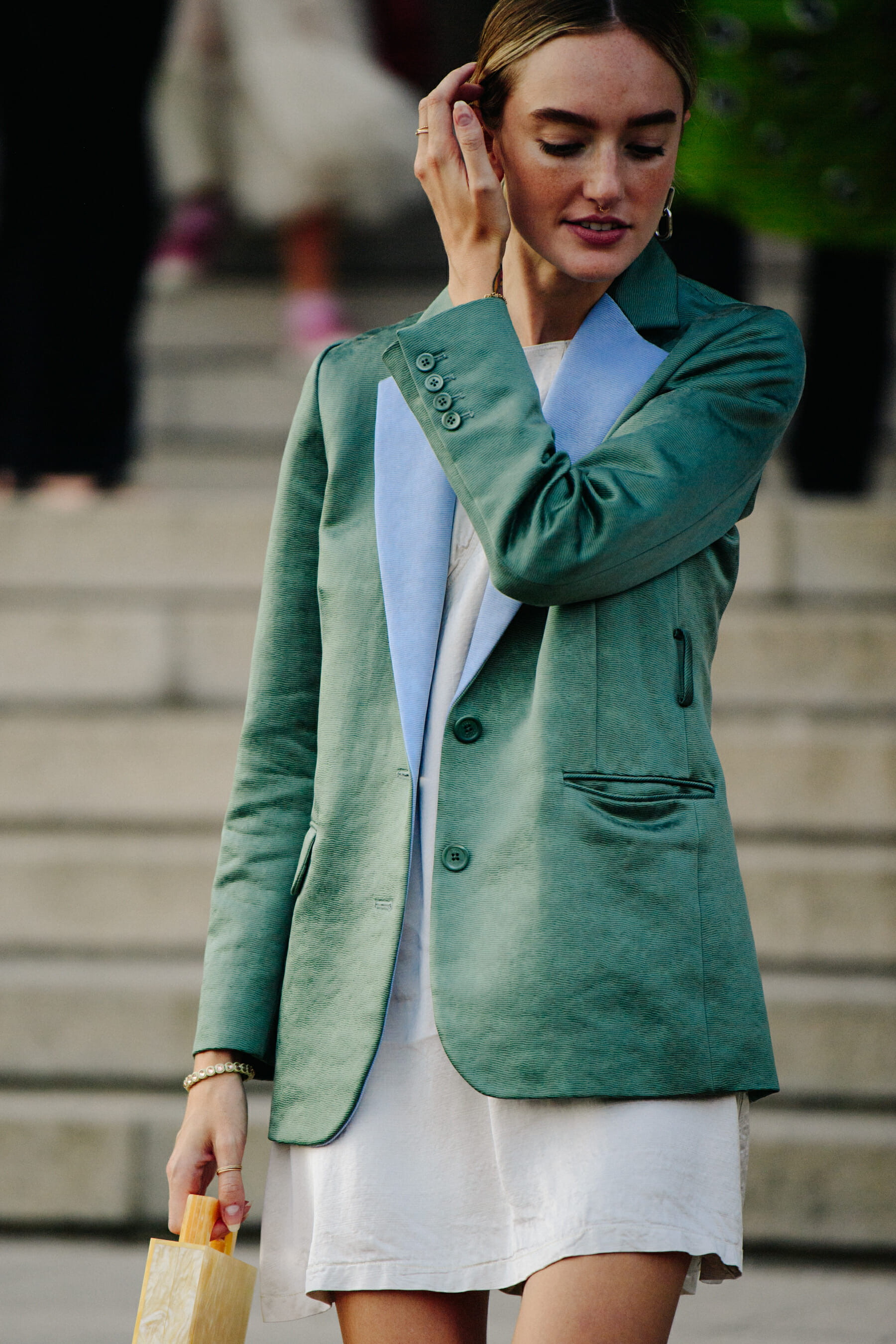 Woman wearing green blazer