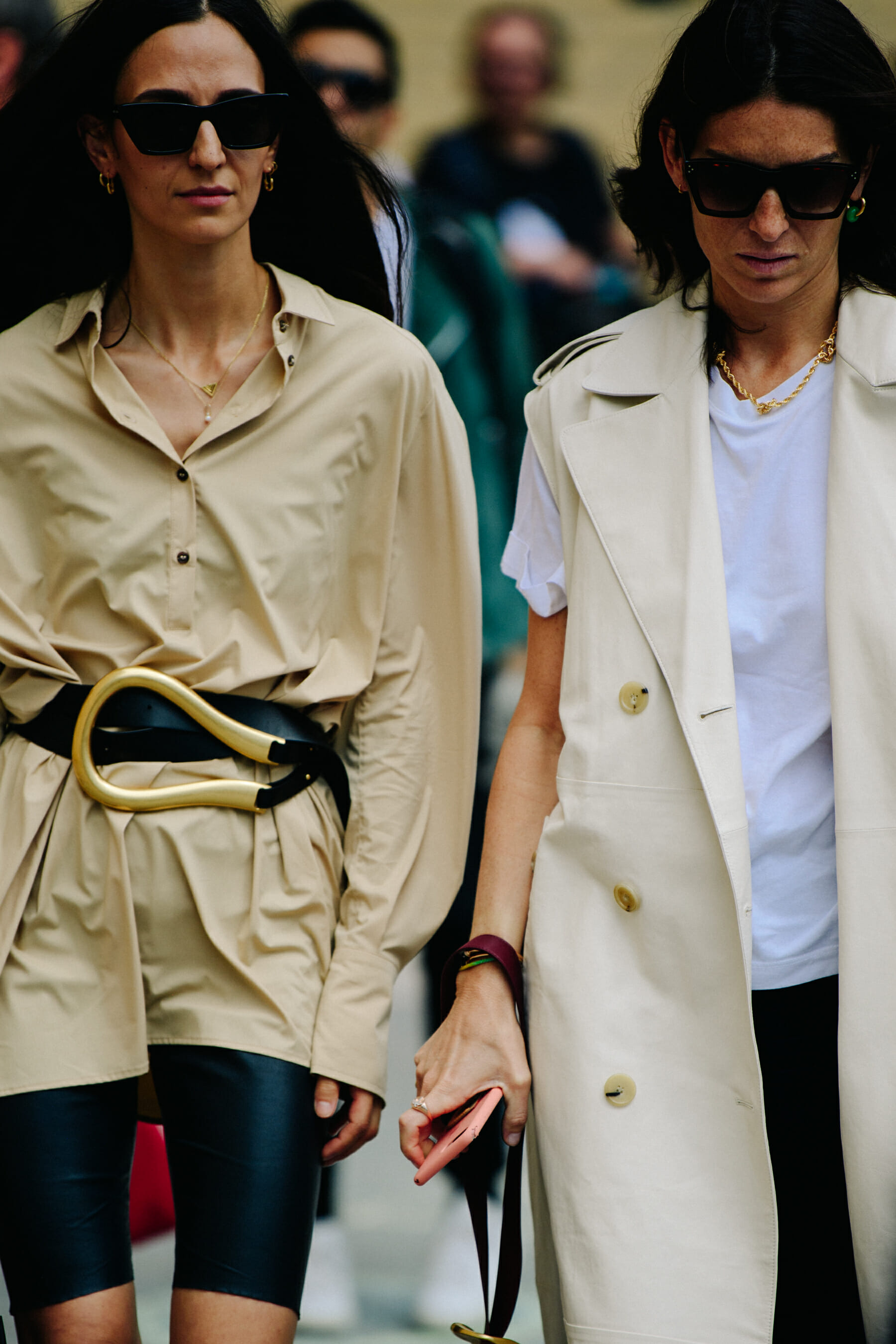 Two women wearing tan