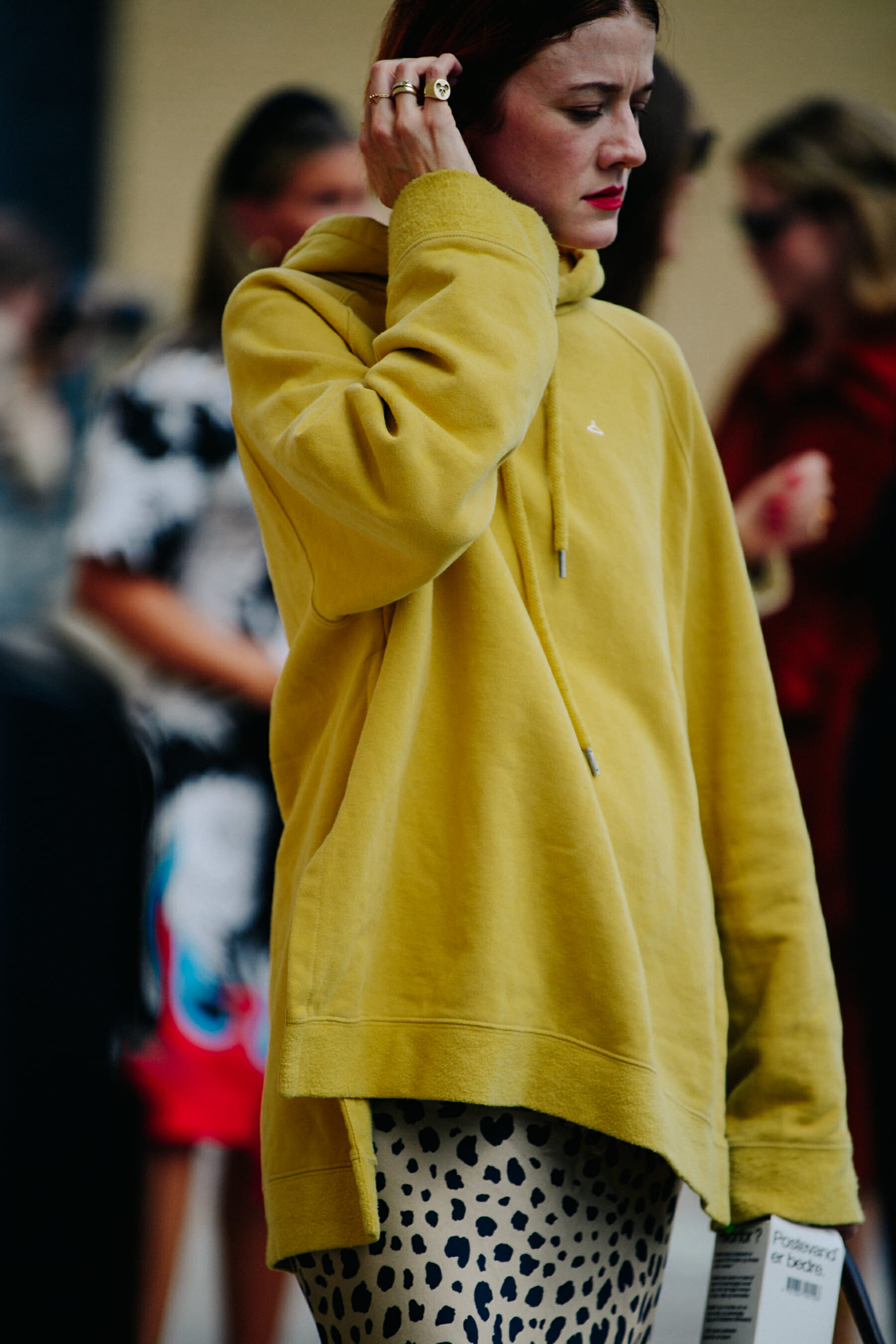 Blogger wearing yellow Holzweiler hoodie