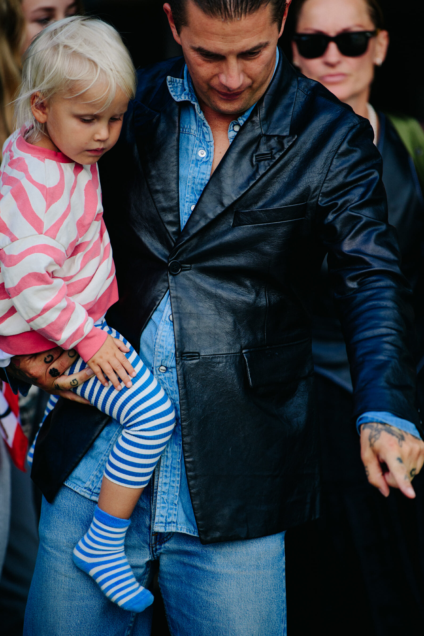 Man carrying small child